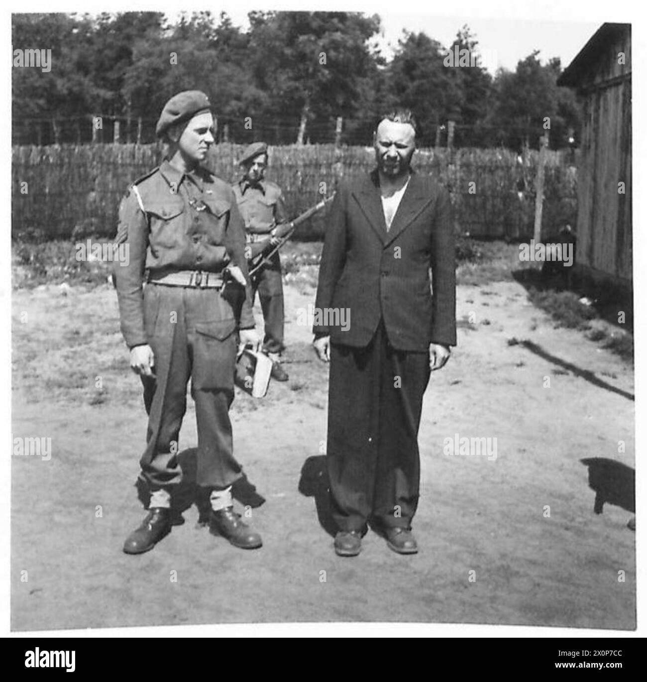 'DACHAU' COMMANDANT - These pictures are of Alex Bernard Hans Pickowski, Camp Commandant of Dachau Concentration Camp. Pickowski was born in Bremen, lsy July 1904. He was made 'Lager F�hrer' of Dachau in Septemner 1939, and was there 6th August 1942. He held the rank of 'Oberst Leutenent' and is now behind barbed wire at Westertimke, N.E. of Bremen. Photographic negative , British Army, 21st Army Group Stock Photo