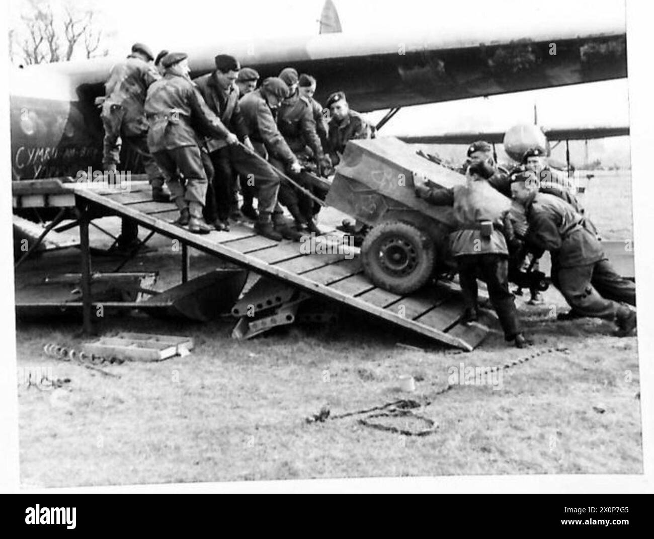 THE AIRBORNE OPERATION - A jeep trailer being hauled aboard a glider. Photographic negative , British Army Stock Photo