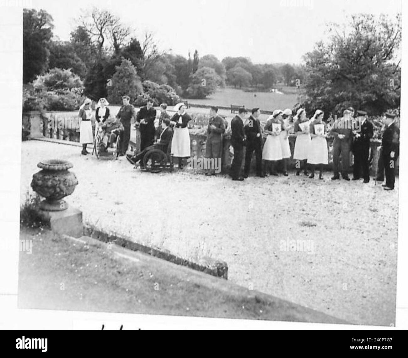 BEAUTIFUL COUNTRY HOUSES AS CONVALESCENT HOMES A group of nurses and patients on the terrace
