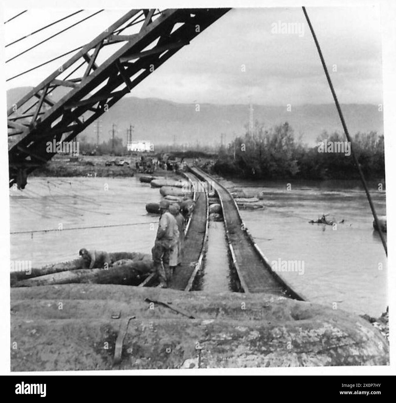 ITALY : FIFTH ARMYITALIAN FLOODS CREATE BRIDGE HAVOC - American engineers repairing the pontoon bridge Photographic negative , British Army Stock Photo