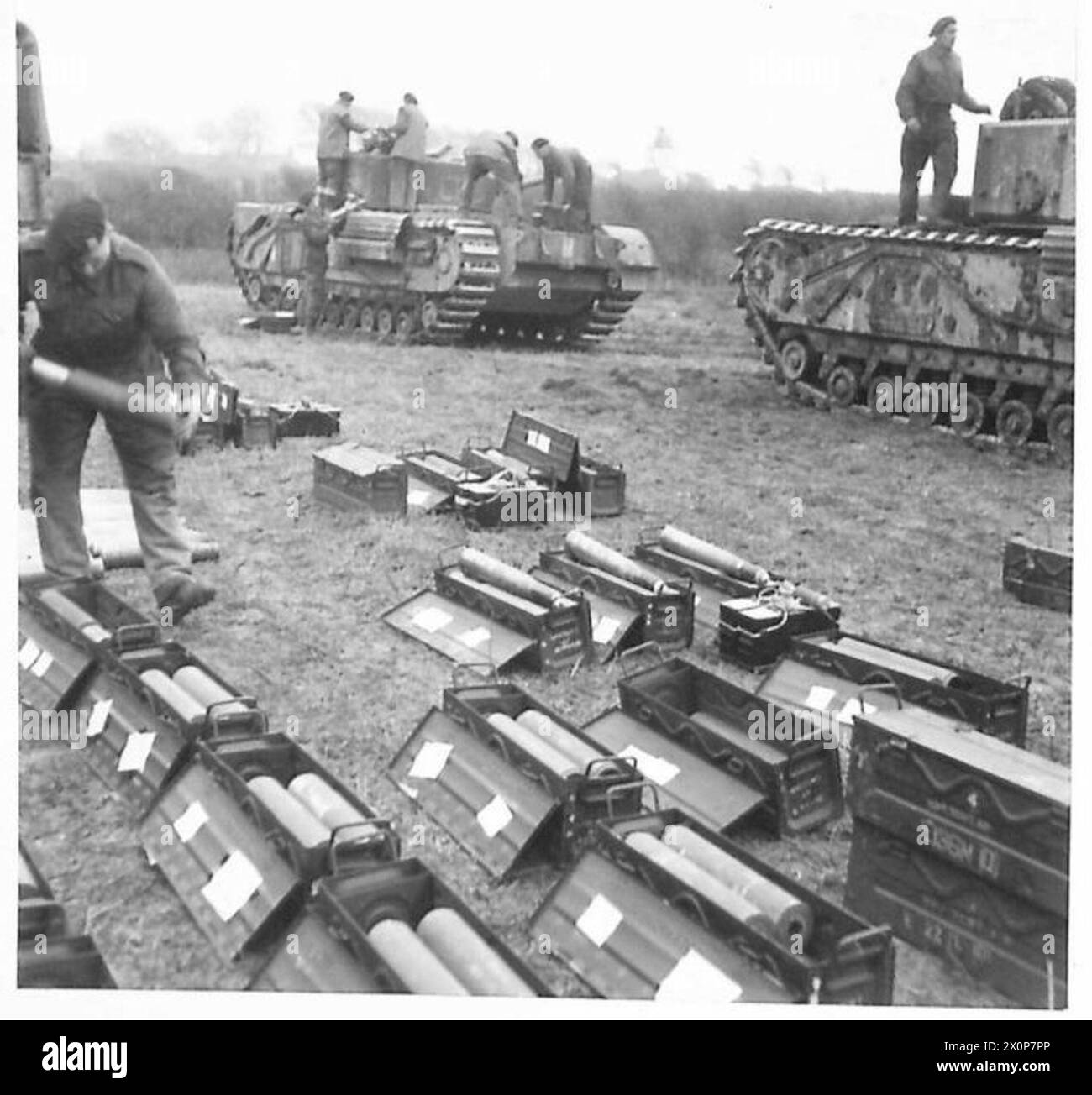 TANK CREWS IN TRAINING - Shells are unpacked for loading into Churchill Tanks. Photographic negative , British Army Stock Photo