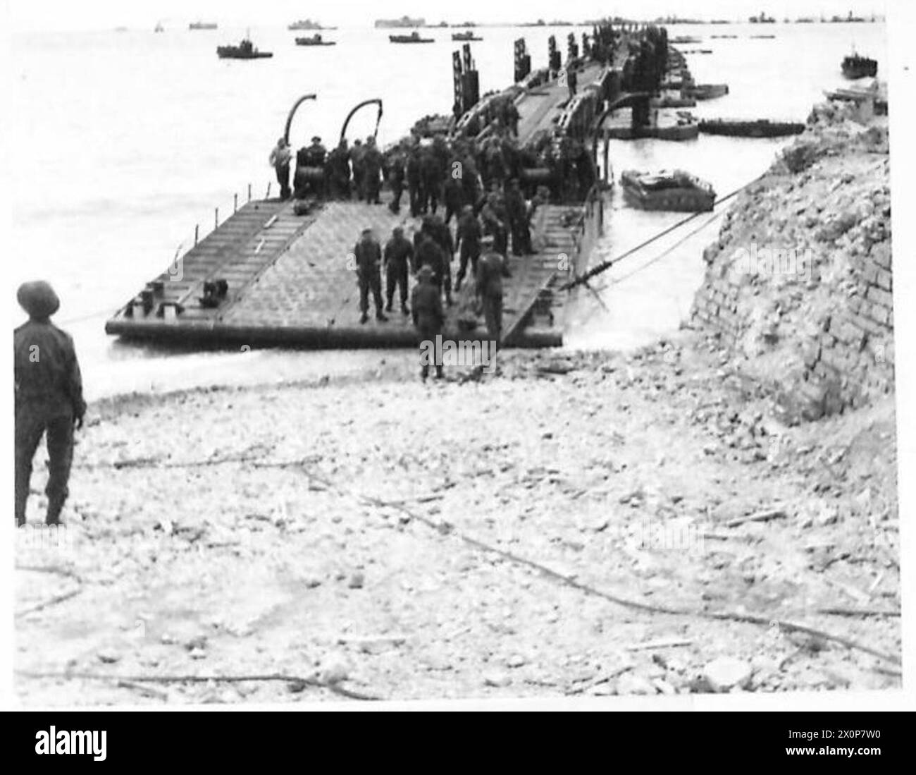 A shore ramp float and the first portion of a prefabricated roadway are ...