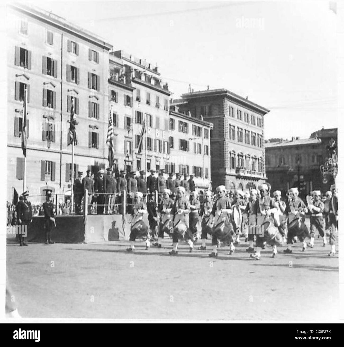 ROME : RED ARMY DAY PARADE - The Band of La Nouba des Tirailleurs Algeriens marches past the saluting base. Photographic negative , British Army Stock Photo