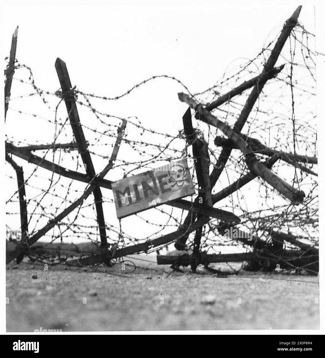 Axis troops abandoned Mine Warning notices during a rapid retreat as British Eighth Army captured the Mareth Line, with mines remaining in position. Stock Photo