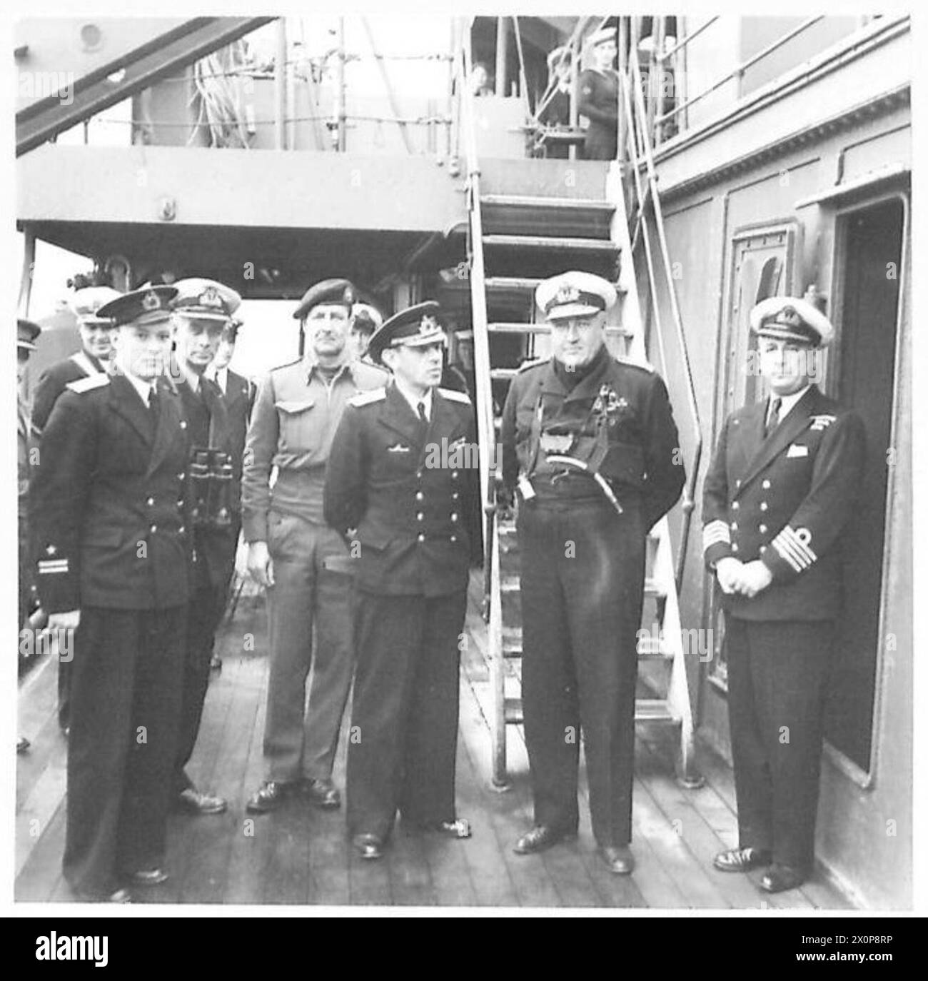 ITALY : ALLIED LANDING AT ANZIO - Rear Admiral Frolov of the Russian Navy with Rear Admiral T.H. Troubridge on board his command ship HMS 'Bololo' off Anzio, during recent landing operations. Admiral Frolov is the Russian expert on Combined Operations and came as an observer during the assaults on Anzio. Admiral Troubridge comes from a famous Naval family and one of his ancestors was the Naval captain under Nelson who landed and relieved Rome during the first year of the 19th century. The then Pope authorised Troubridge's ancestor to bear the Papal keys on his crest to signify the occasion. Th Stock Photo