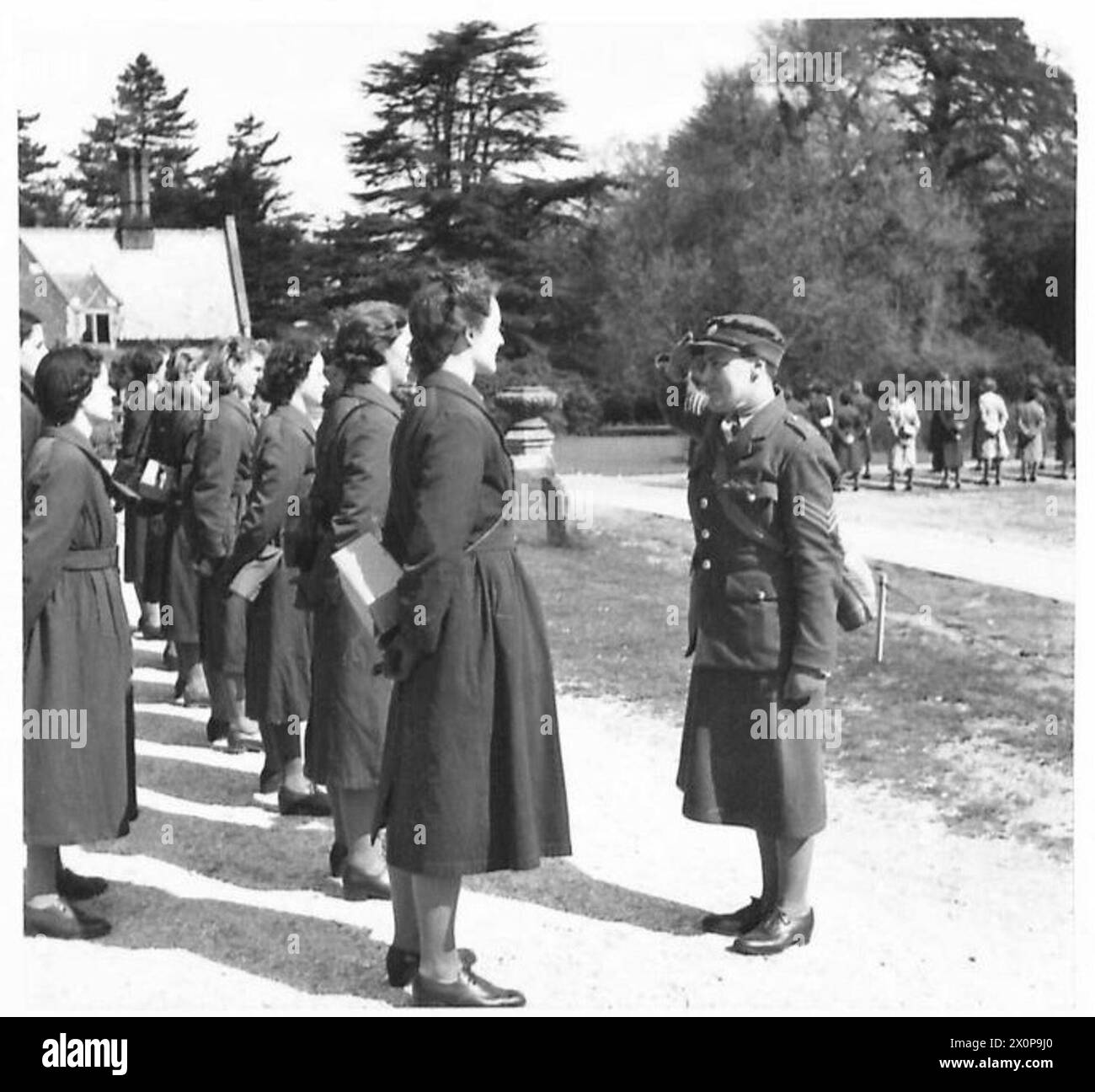 A.T.S. IN TRAINING - Learning the correct way to salute. Recruits are