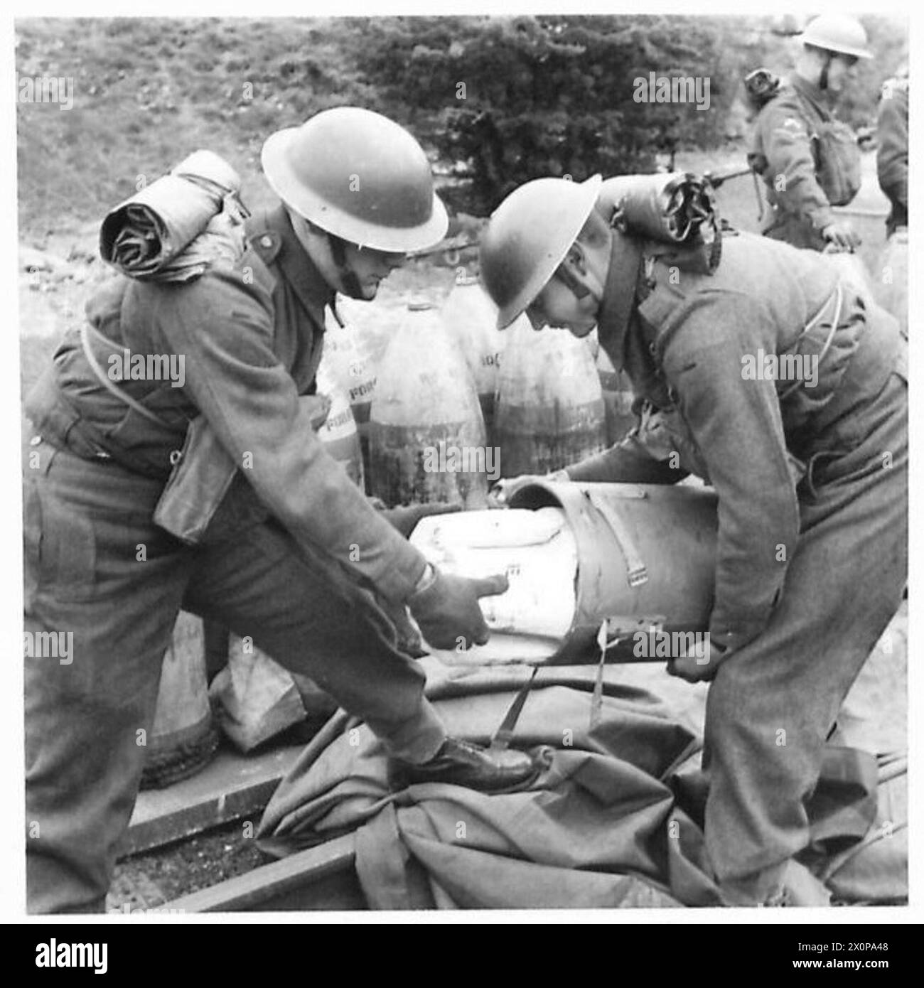 SAVE YOUR WASTE PAPER The cordite charges being taken out of the