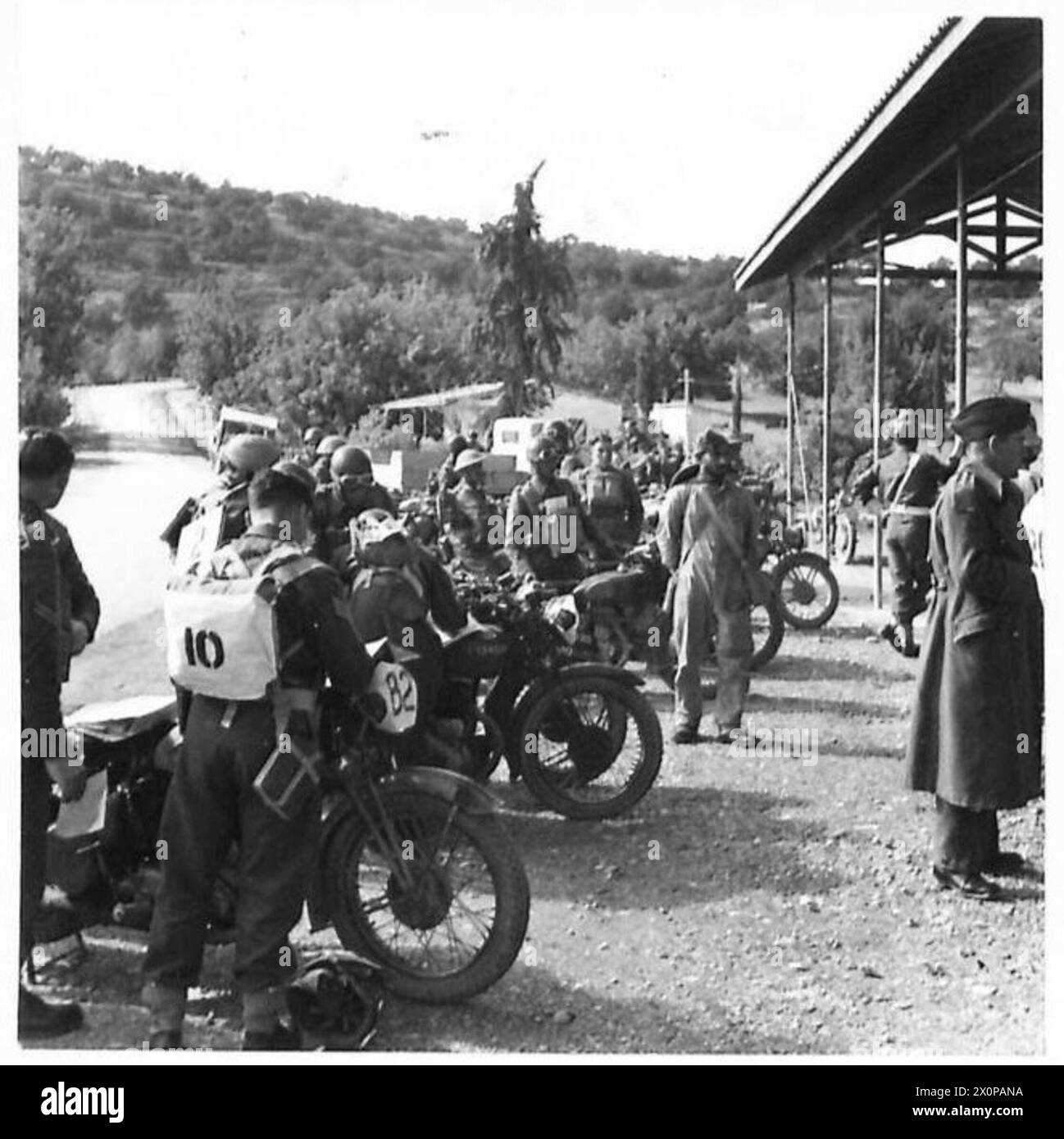 Dispatch Riders assemble at the starting point for a motorcycle trial ...