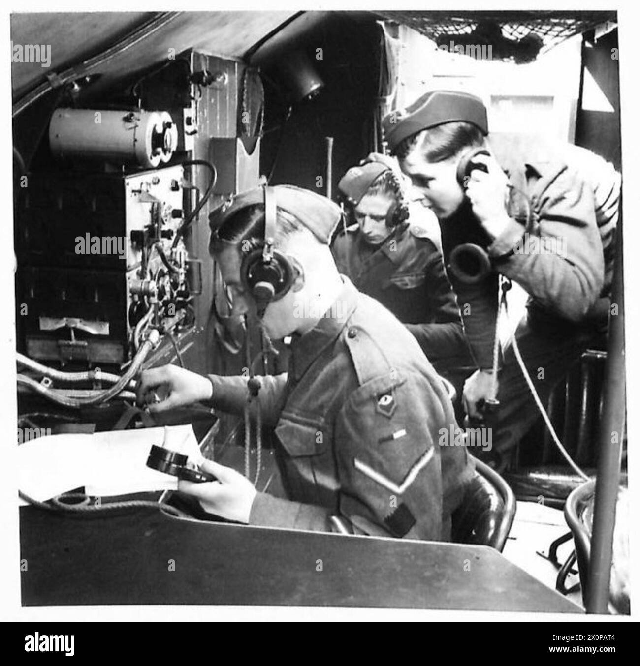 Signallers at work in the field interior of an armoured command