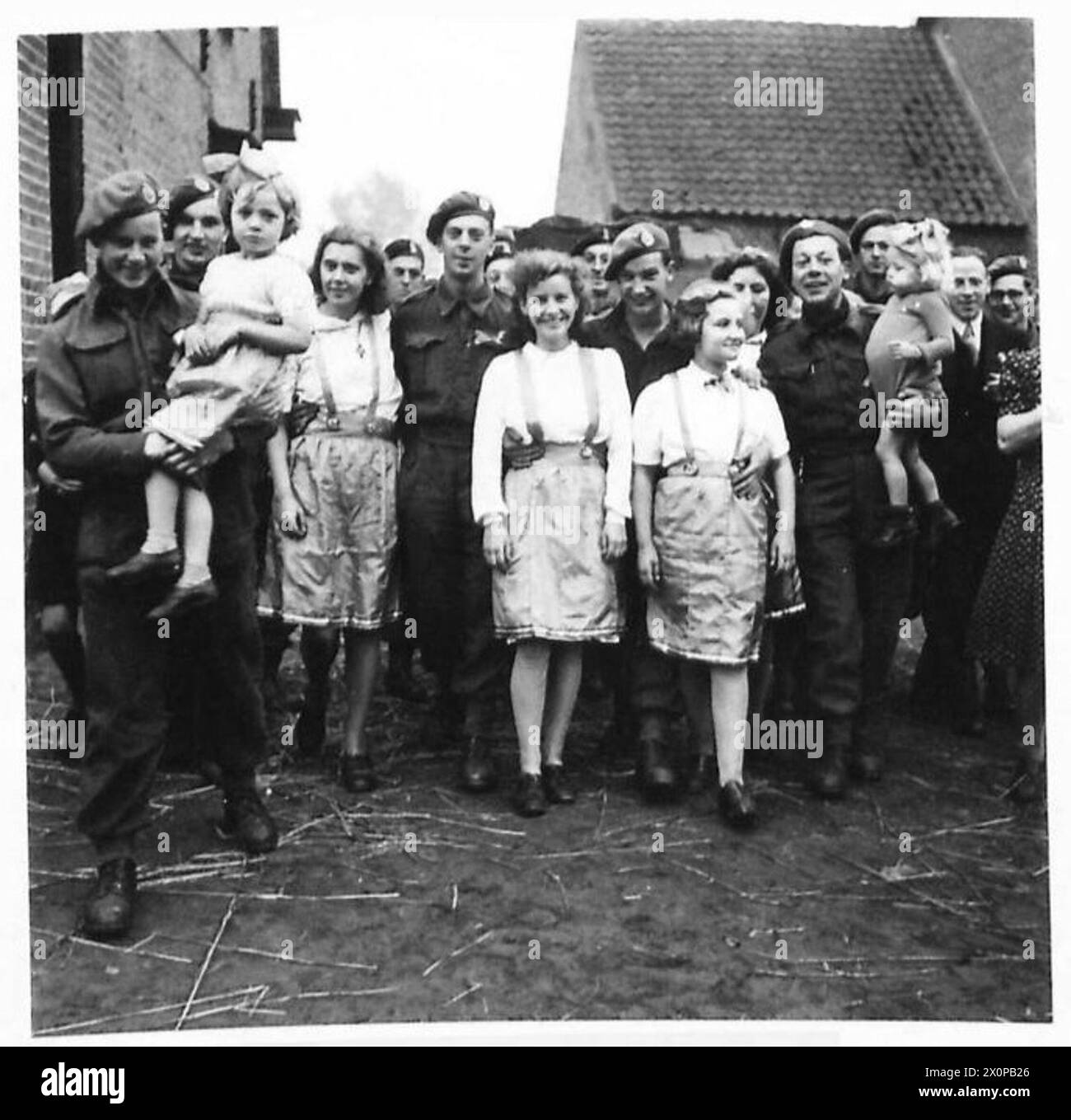 11th. ARMOURED ADVANCE. - The soldiers soon make friends with the inhabitants of Heeze. Photographic negative , British Army, 21st Army Group Stock Photo