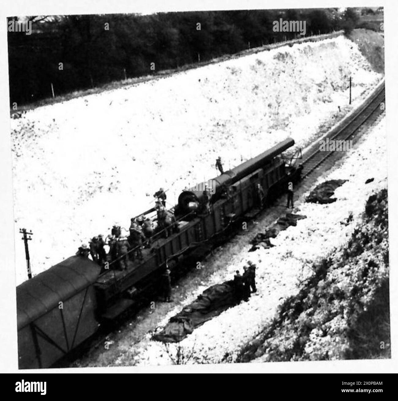 H.M.G. "BOSHE BUSTER IN ACTION - The big gun being got ready for the