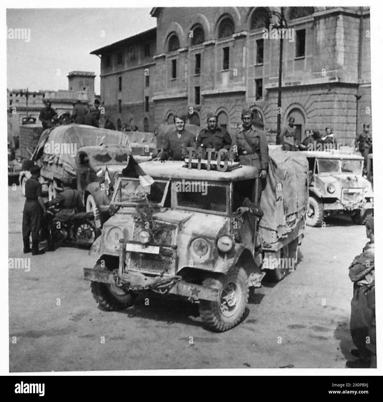 YUGOSLAVS LEAVE TRIESTE - A 15-cwt truck carrying Yugoslav troops sets off from the Piazza della Liberta, a square adjoining the main railway station at Trieste. Photographic negative , British Army Stock Photo