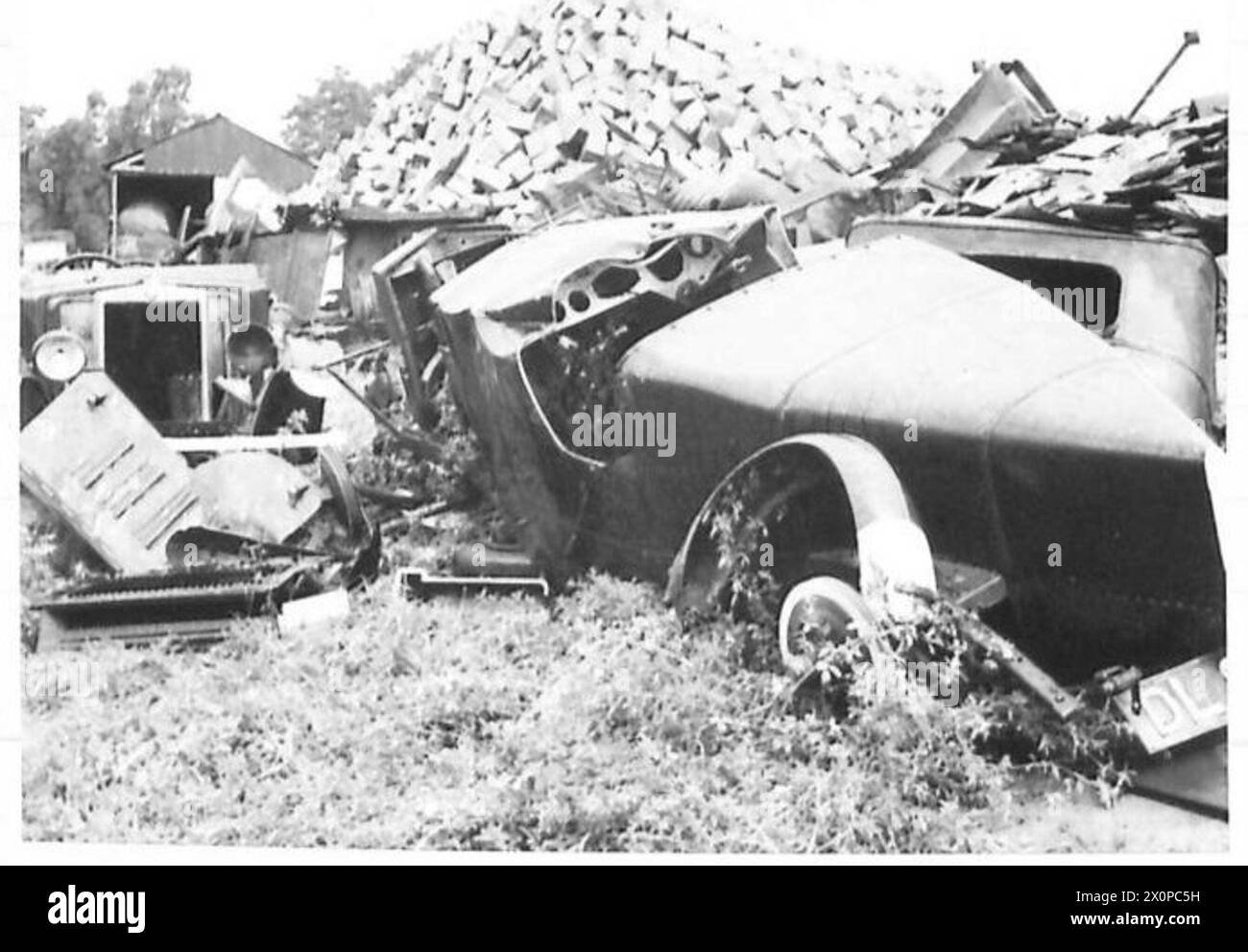 EXTENSIVE SALVAGE IN THE EASTERN COMMAND - Scrap metal. An old Italian Fiat racing car was amongst the scrap on the dump. Photographic negative , British Army Stock Photo