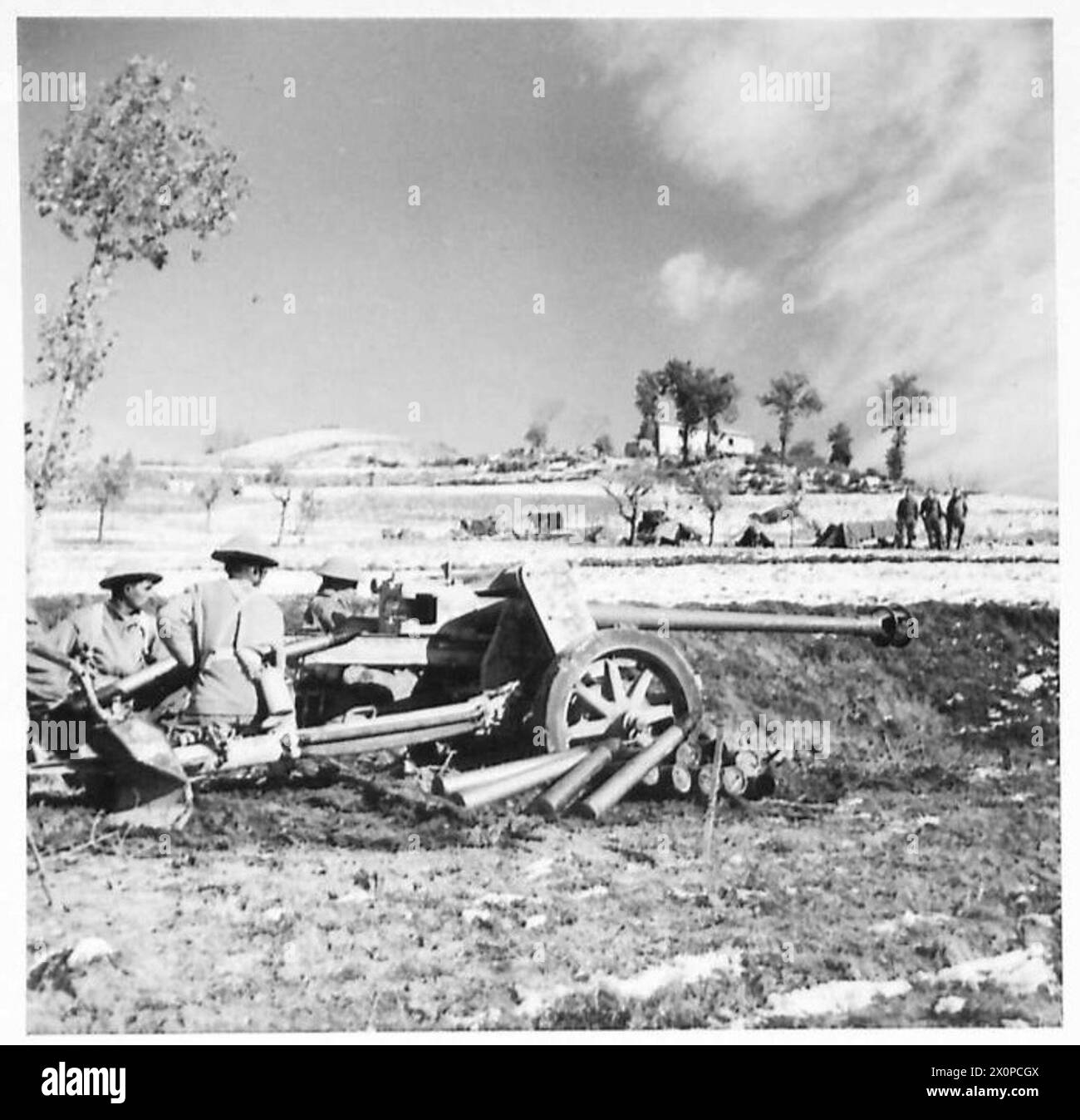 FIFTH ARMY : VARIOUS - This German 75 mm anti-tank gun was captured by the 24 Frontier Force Rifles, and handed over to 15 Bty. 4 Mahratta A/Tk Regiment, who have since used it to 'return' 200 rounds of German ammunition to its former owners. Photographic negative , British Army Stock Photo