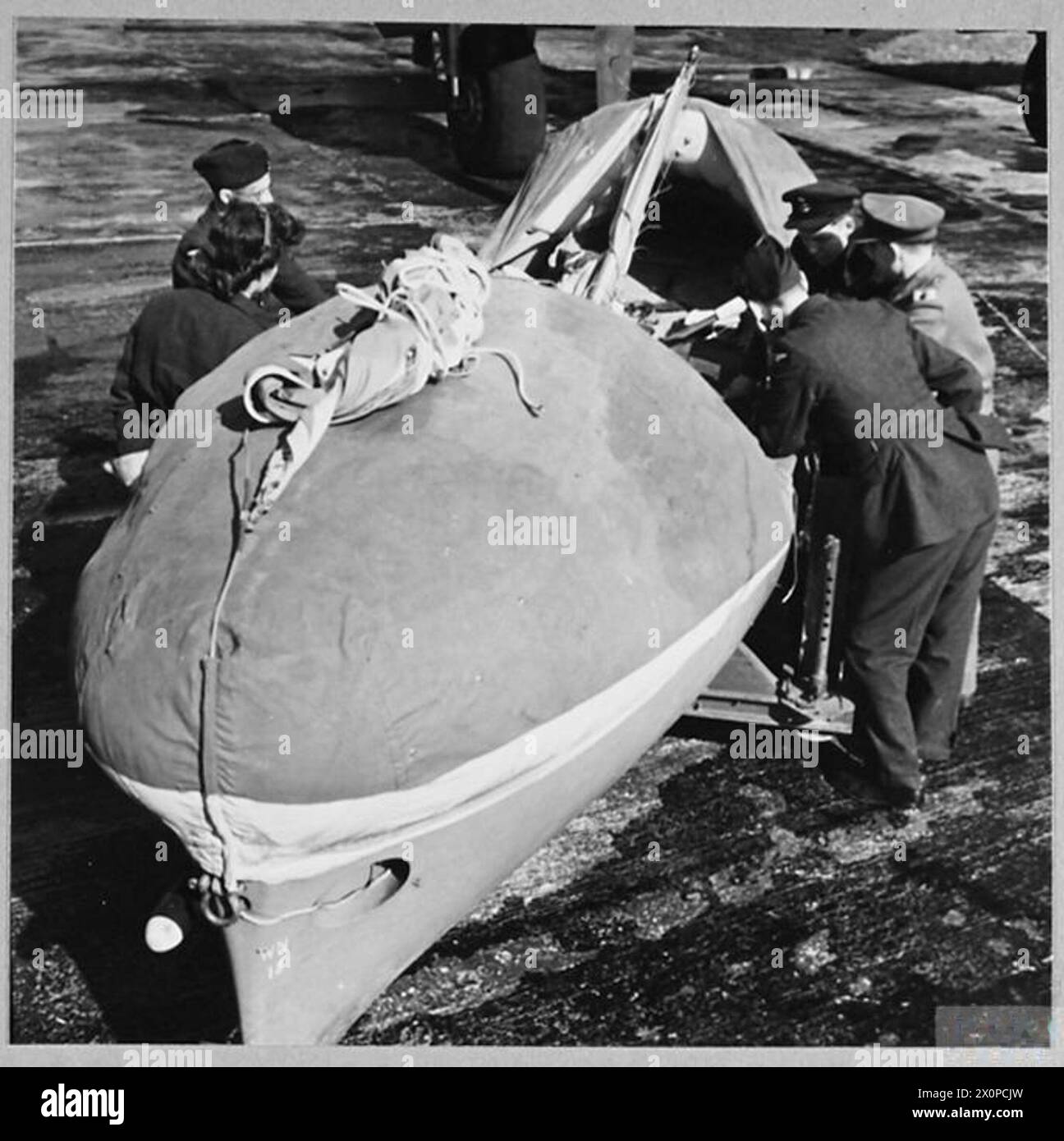 R.A.F's AIRBORNE LIFEBOATS : For story see CH.13910 - Picture (issued 1944) shows - The lifeboat showing the two buoyancy chambers under the covers. Photographic negative , Royal Air Force Stock Photo