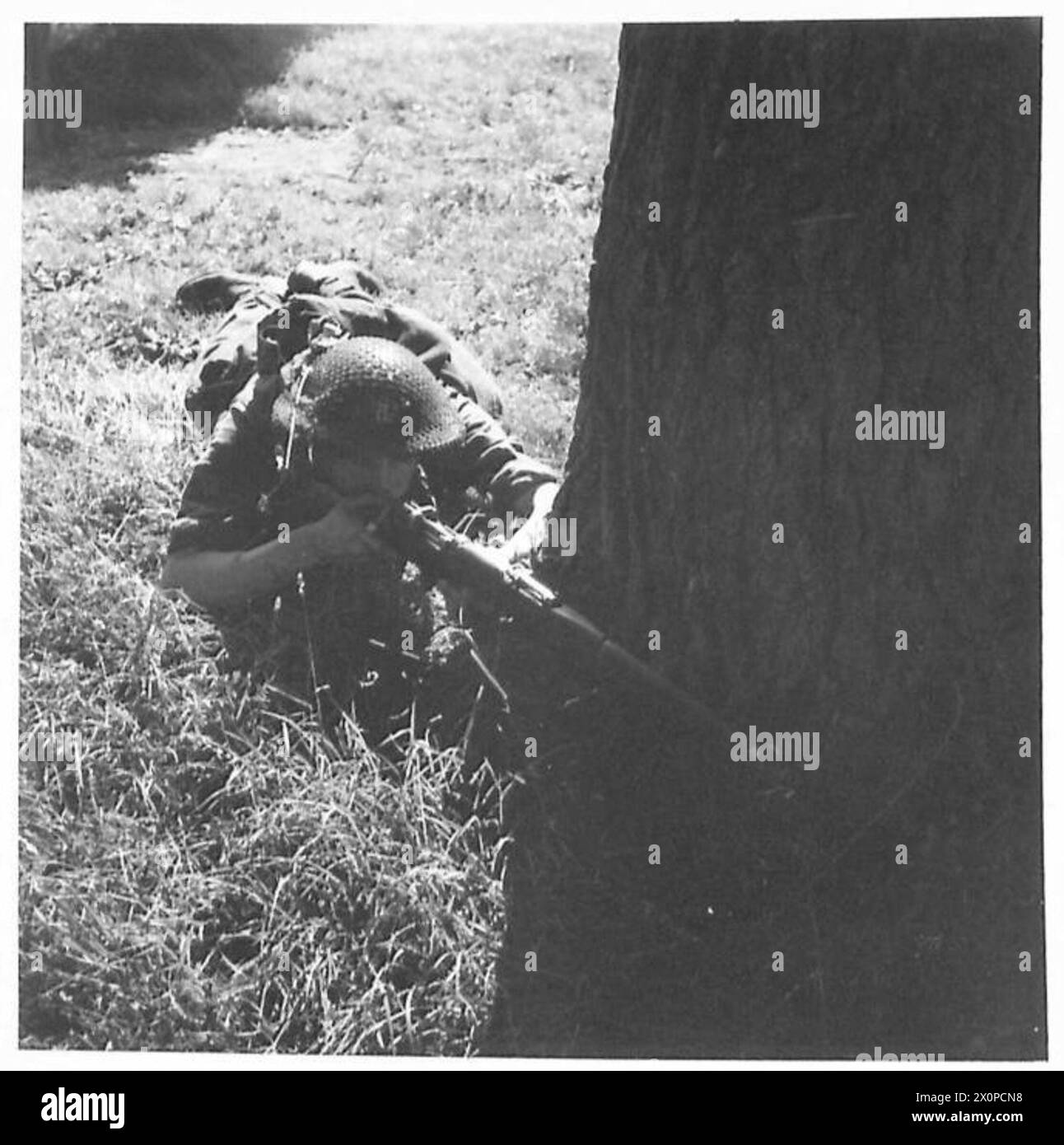 MOPPINGUP OPERATIONS A sniper sights his gun on one of the 'enemy