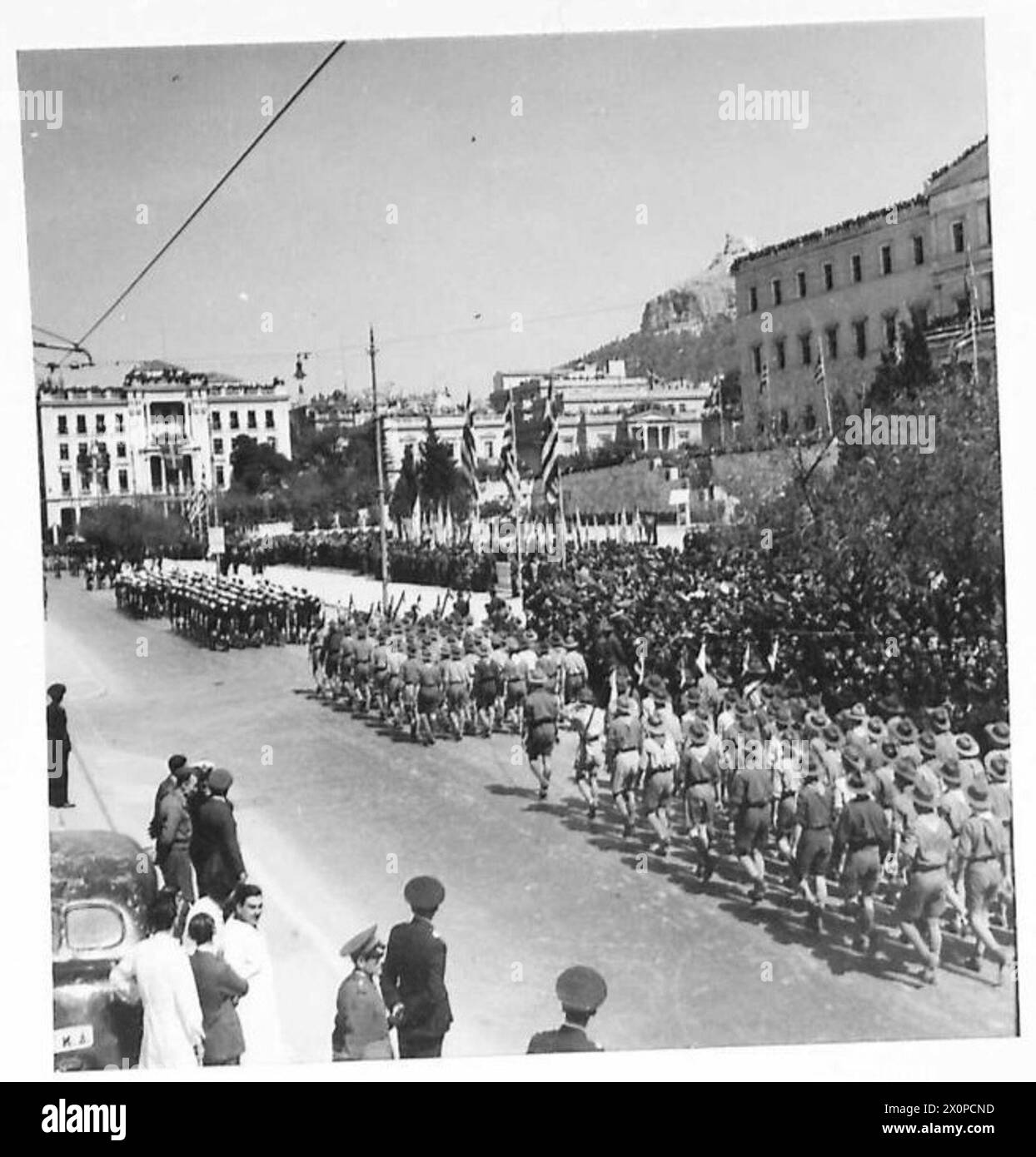 ATHENS CELEBRATES INDEPENDENCE DAY - Youth Movements including Boy Scouts Movement take part in the Parade, and file past the saluting base where Archbishop Damaskinos and other High Ranking Officials review. Photographic negative , British Army Stock Photo