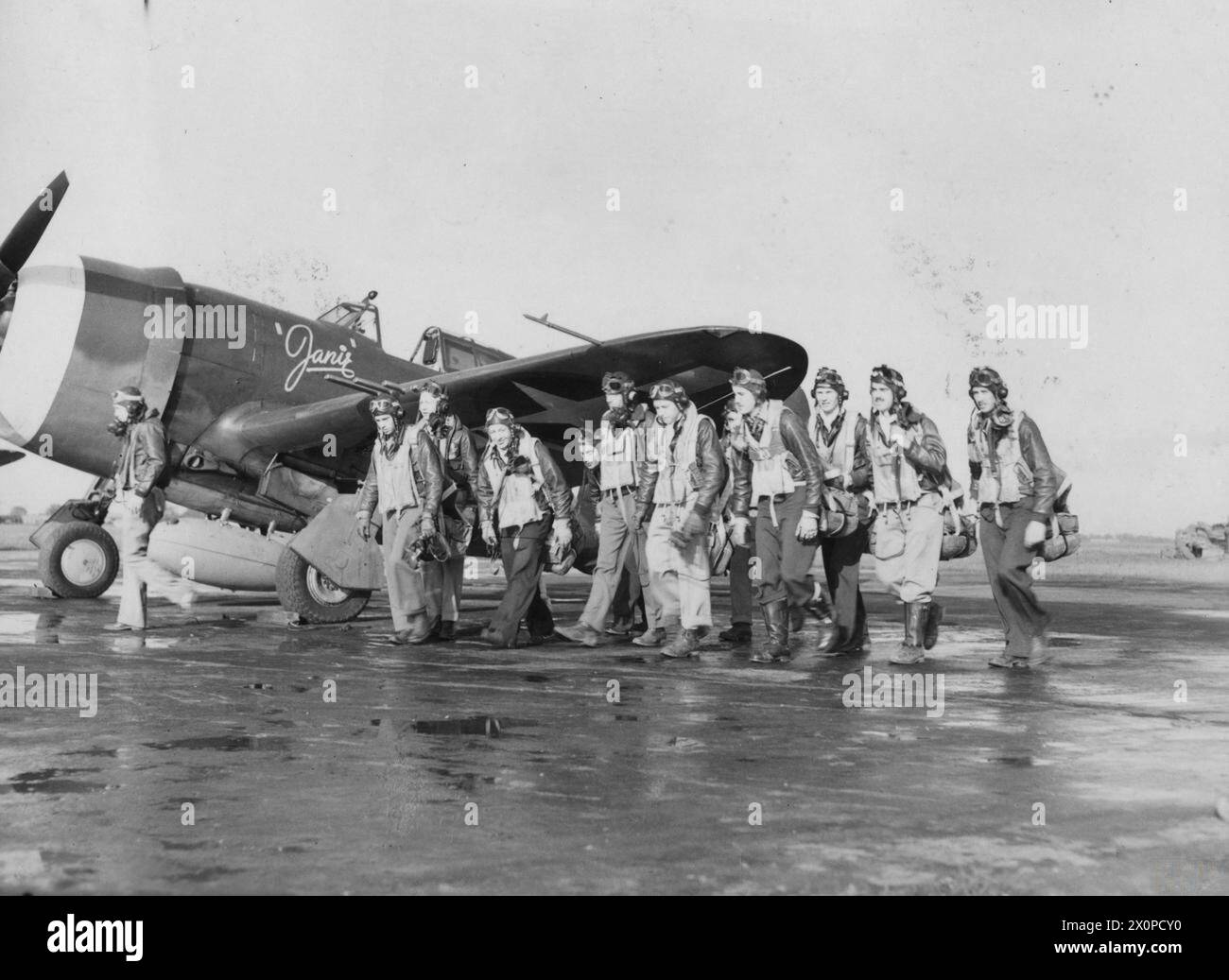 Metfield Pilots of the 353rd Fighter Group pose in front of a P-47 Thunderbolt ...