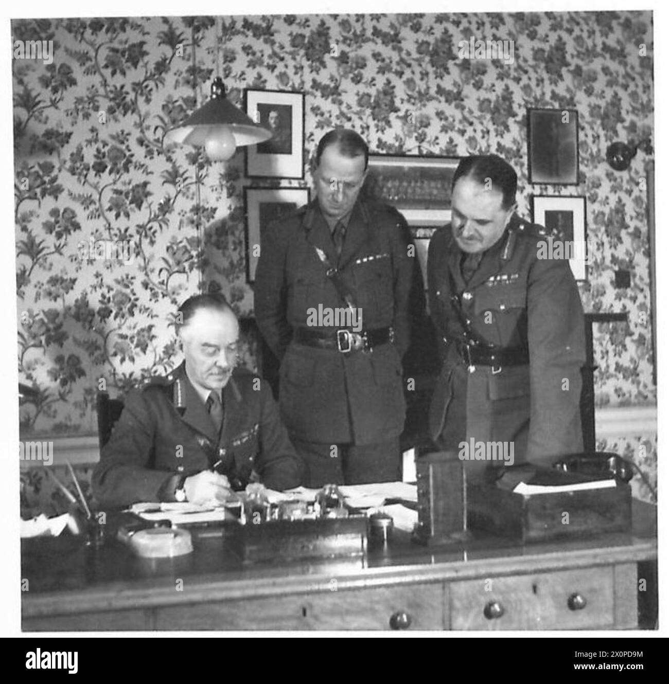 THE G.O.C. SCOTTISH COMMAND - Lieut. General Sir R. Harold Carrington, KCB., DSO., GOC Scottish Command with Major General H.M. Gale, CBE., MC., a Major General in charge of Administration and Brigadier T.N.F. Wilson, DSO., MC., Photographic negative , British Army Stock Photo