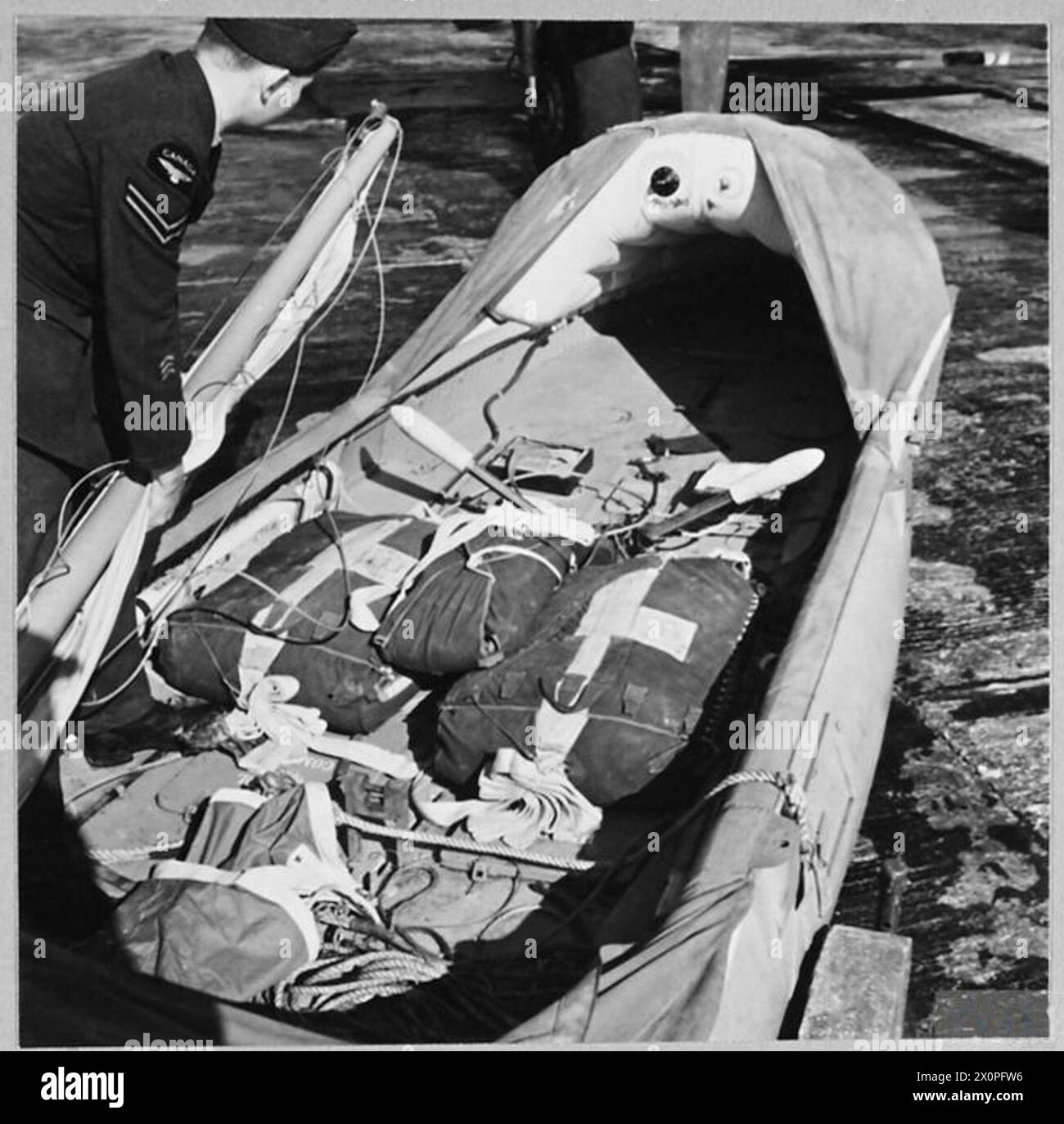 R.A.F's AIRBORNE LIFEBOATS : For story see CH.13910 - Picture (issued 1944) shows - The parachutes fitted to the lifeboat. Directly it leaves the Warwick the aircraft the parachute operates. Photographic negative , Royal Air Force Stock Photo