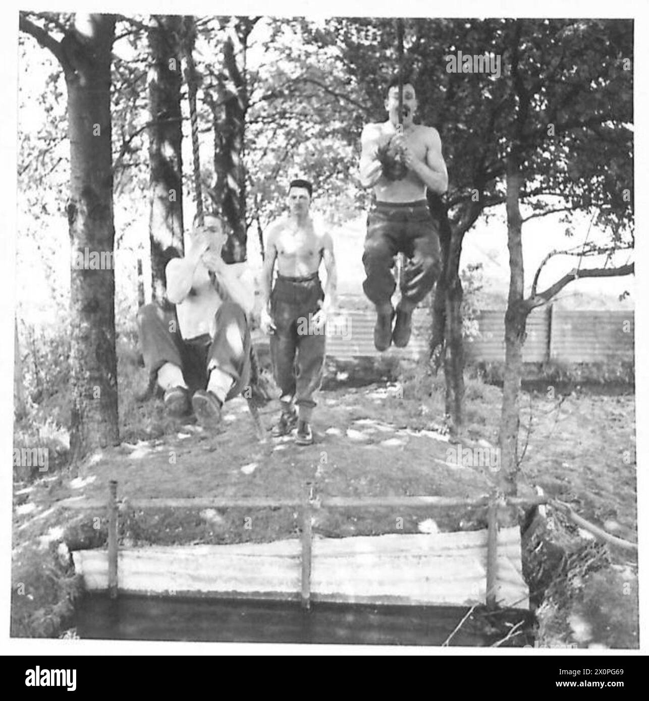 PHYSICAL TRAINING SCHOOL AT HENDON Rope Swing over ditch Backward