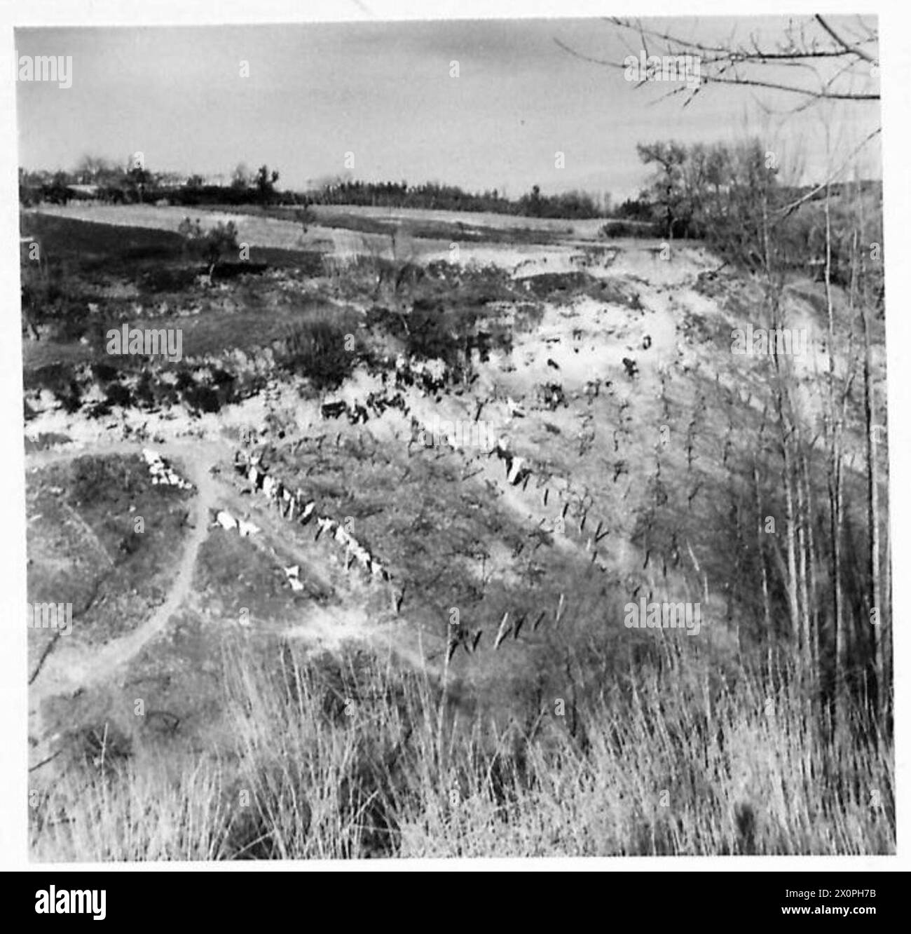 Inhabitants of San Nicola move to valley grottoes after bombing and shelling in a front line village under Eighth Army operations. Stock Photo