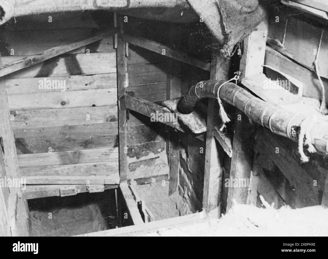 THE GREAT ESCAPE, MARCH 1944 - Entrance to the 'Harry' escape tunnel at Stalag Luft III, Sagan. Photograph probably taken in late March 1944 Royal Air Force Stock Photo