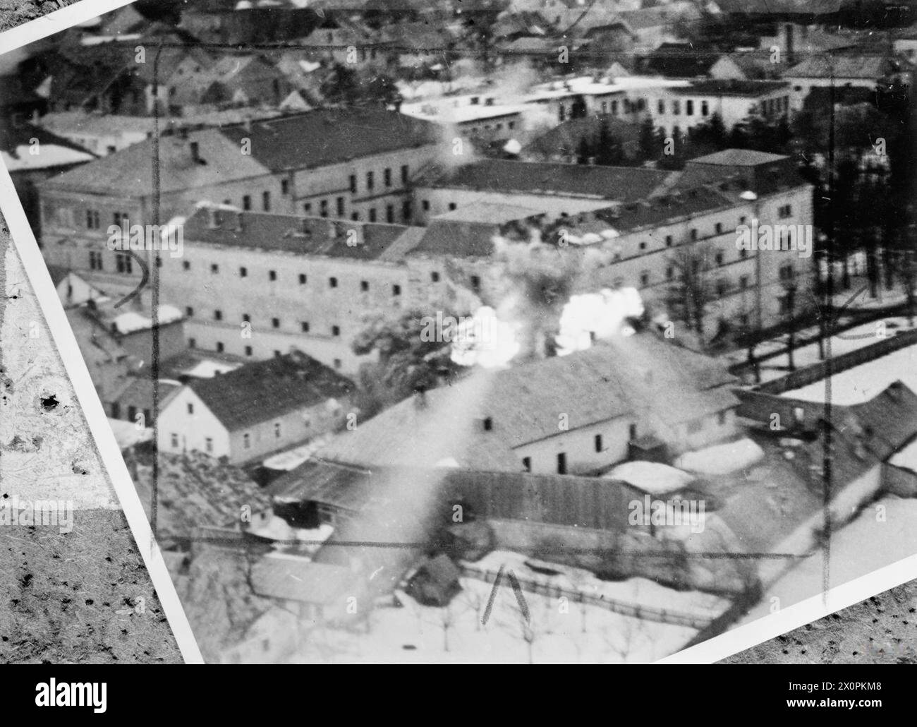 ROYAL AIR FORCE: ITALY, THE BALKANS AND SOUTH-EAST EUROPE, 1942-1945. - Still from film shot from the nose camera of a Bristol Beaufighter, flown by Lt Burne of No. 16 Squadron SAAF, showing rocket projectiles from his aircraft exploding on an enemy-occupied building in the village of Gospic, Yugoslavia South African Air Force, Sqdn, 16 Stock Photo