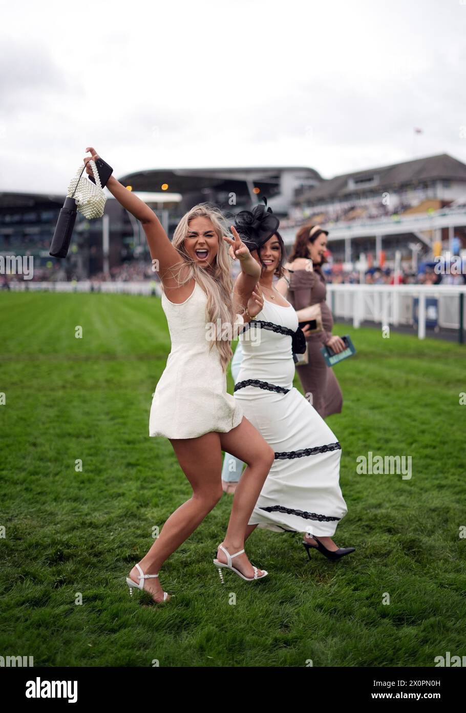 Randox Races Racegoers cross the course on day three of the 2024 Randox Grand ...