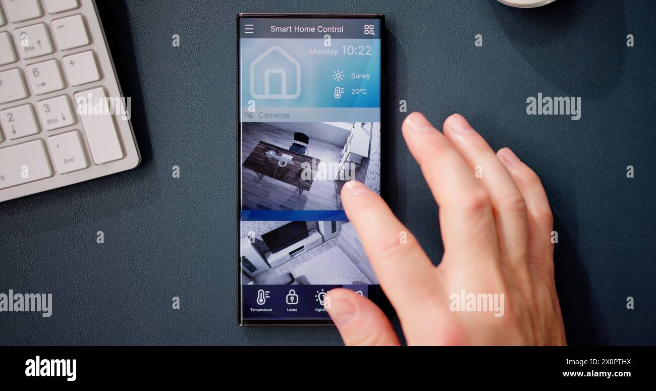 Smart Home CCTV Security On Mobile Phone Or Smartphone Stock Photo