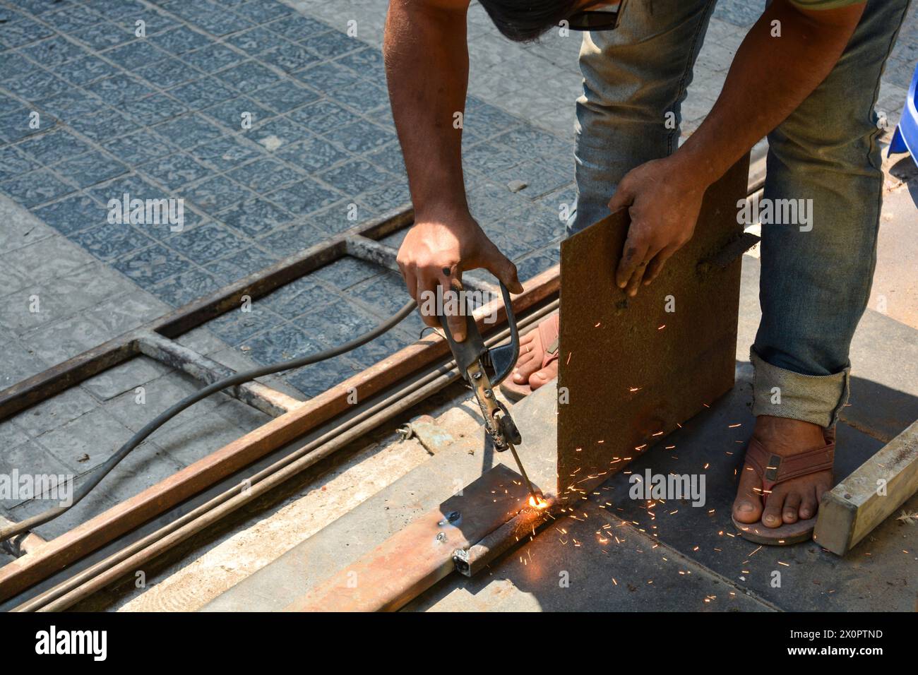 Welding Job works in the rolling shutter factory Stock Photo