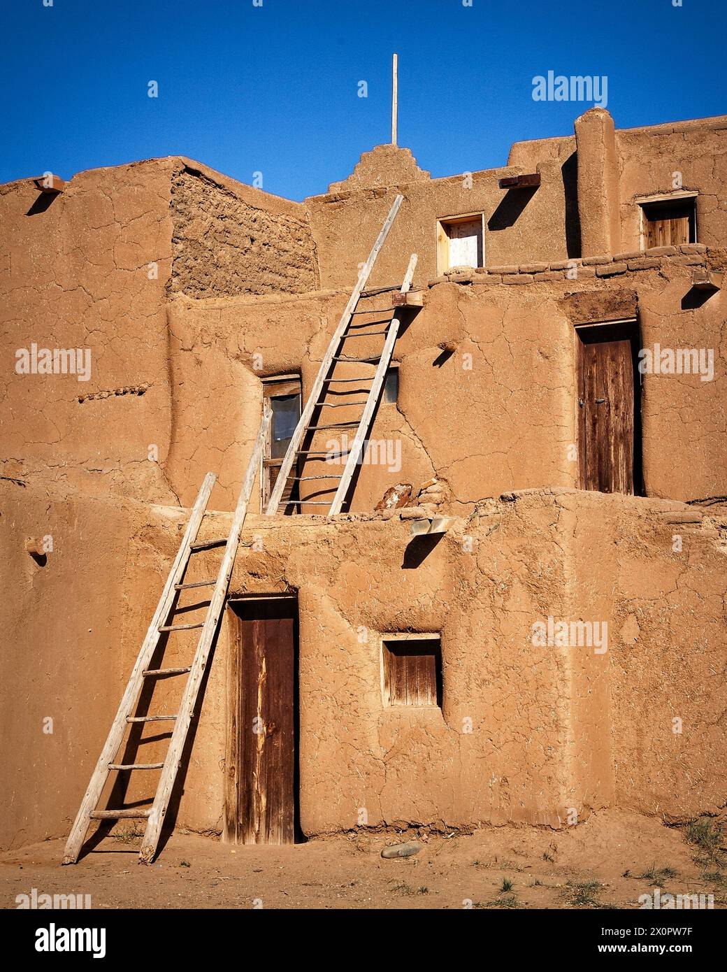 The rising adobe levels of the historic Taos Pueblo in Taos, New Mexico. Stock Photo