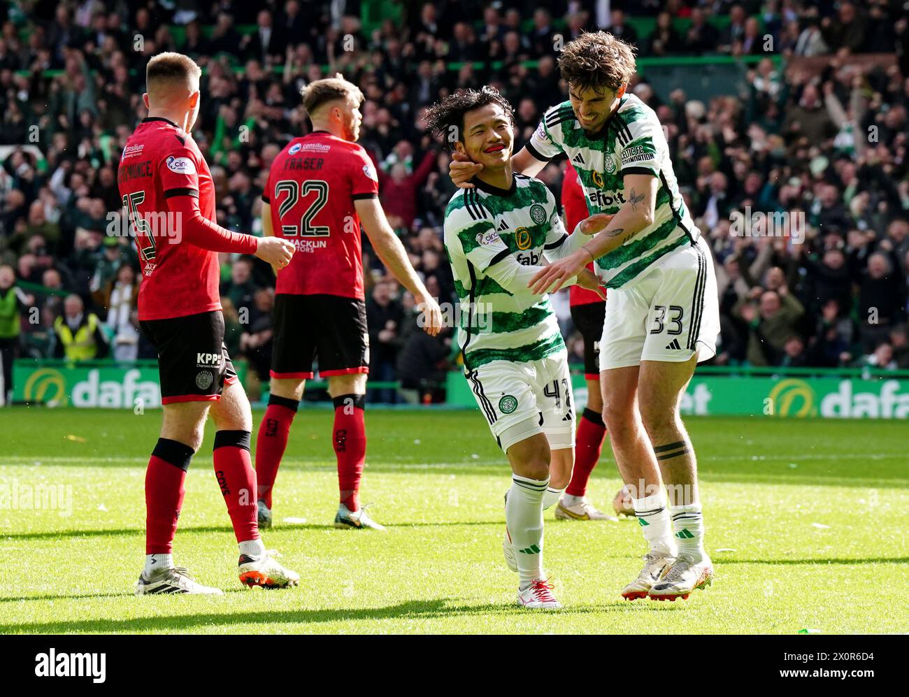 Celtic's Reo Hatate (second right) celebrates with Matt O'Riley after scoring his sides first goal of the game during the cinch Premiership match at Celtic Park, Glasgow. Picture date: Saturday April 13, 2024. Stock Photo