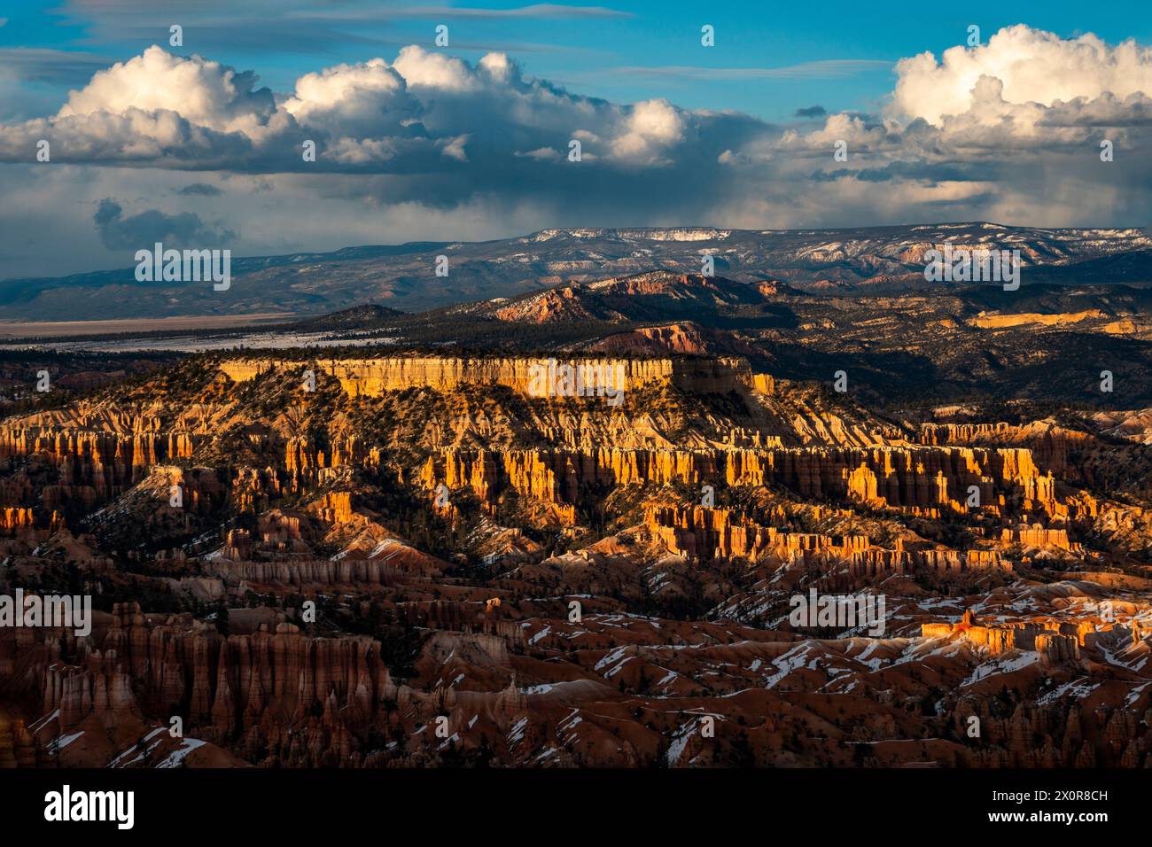 Winter evening sunset with storm clouds on the horizon above the Amphitheater in Utah's Bryce Canyon National Park. Stock Photo