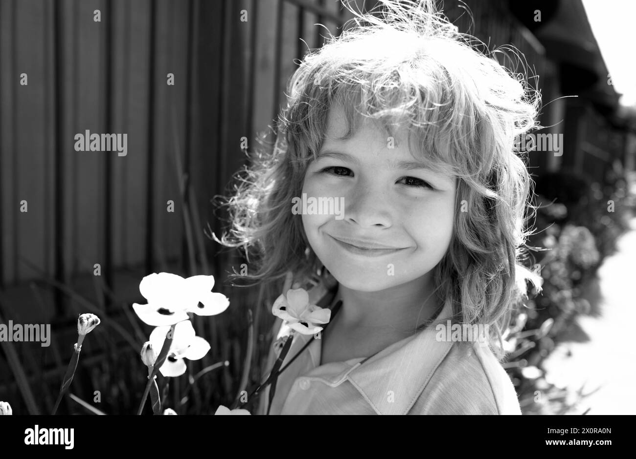 Kids funny face. Happy kid having fun and making faces outdoors