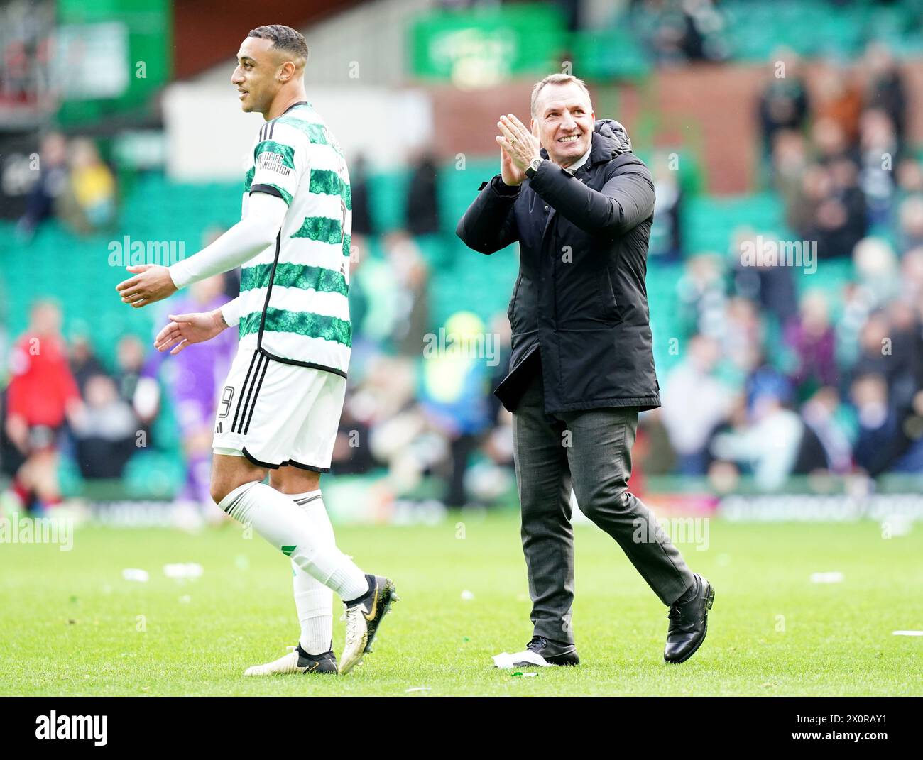 Celtic manager Brendan Rodgers (right) applauds the fans after the cinch Premiership match at Celtic Park, Glasgow. Picture date: Saturday April 13, 2024. Stock Photo