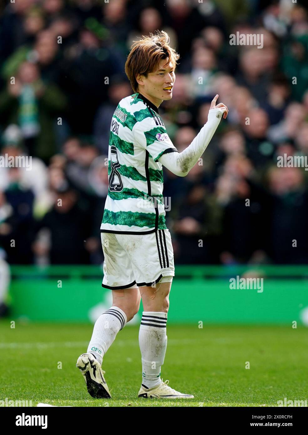 Celtic's Kyogo Furuhashi celebrates after scoring his side second goal of the game during the cinch Premiership match at Celtic Park, Glasgow. Picture date: Saturday April 13, 2024. Stock Photo