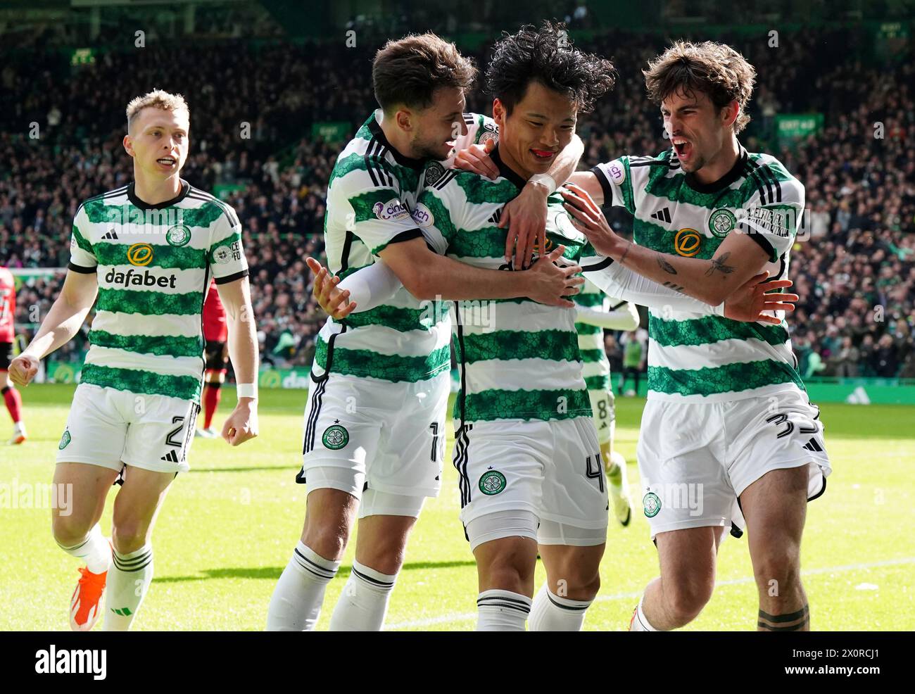 Celtic's Reo Hatate (second right) celebrates with his team mates after scoring his sides first goal of the game during the cinch Premiership match at Celtic Park, Glasgow. Picture date: Saturday April 13, 2024. Stock Photo