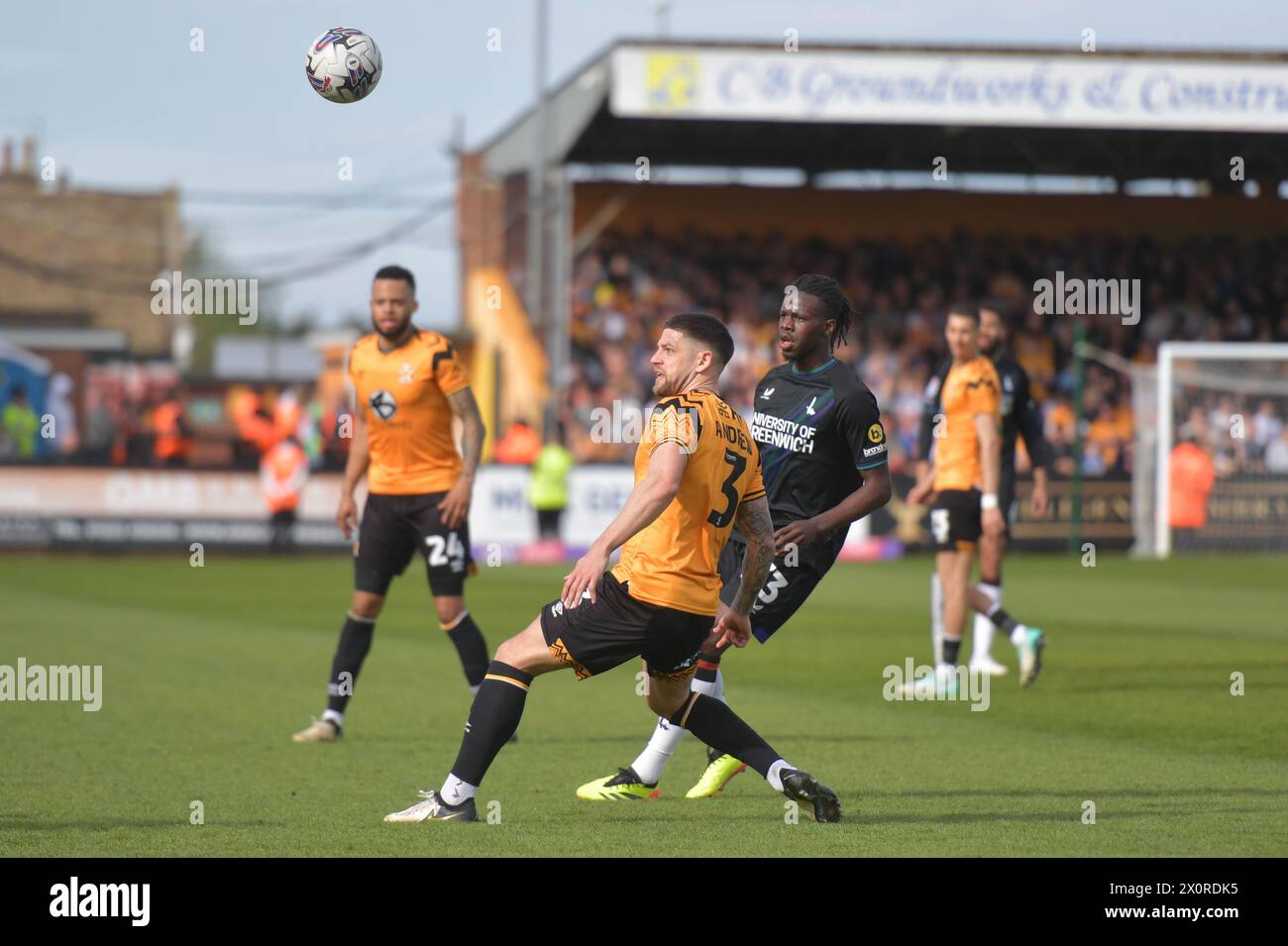 Cambridge, England. 13th Apr 2024. Karoy Anderson of Charlton Athletic and Danny Andrew of Cambridge United during the Sky Bet EFL League One fixture between Cambridge United and Charlton Athletic. Kyle Andrews/Alamy Live News Stock Photo