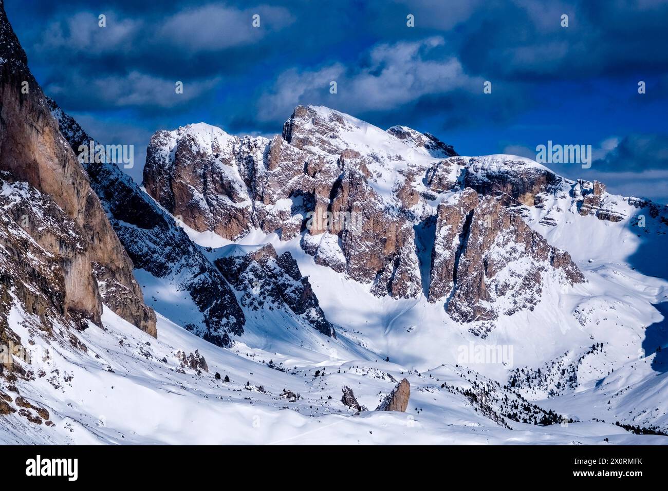 The snow-covered summits of Puez peaks beside the Odle group, surrounded by alpine Dolomite landscape in winter, seen from Seceda. UrtijÃi Trentino-Al Stock Photo
