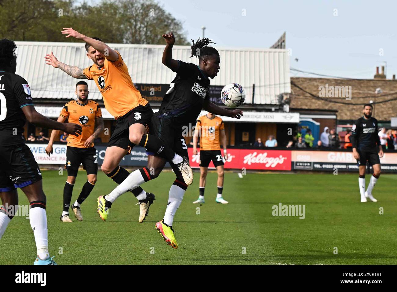 Danny Andrew (3 Cambridge United) and Karoy Anderson (33 Charlton Athletic) challenge for the ball during the Sky Bet League 1 match between Cambridge United and Charlton Athletic at the Cledara Abbey Stadium, Cambridge on Friday 12th April 2024. (Photo: Kevin Hodgson | MI News) Credit: MI News & Sport /Alamy Live News Stock Photo