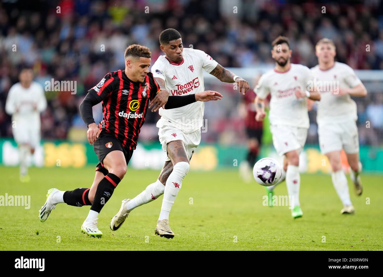 Bournemouth's Max Aarons (left) and Manchester United's Marcus Rashford battle for the ball during the Premier League match at the Vitality Stadium, Bournemouth. Picture date: Saturday April 13, 2024. Stock Photo