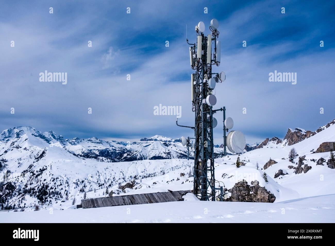 Snow-covered slopes of alpine Dolomite landscape with a telecommunications station above Giau pass in winter. Cortina dAmpezzo Veneto Italy FB 2024 10 Stock Photo