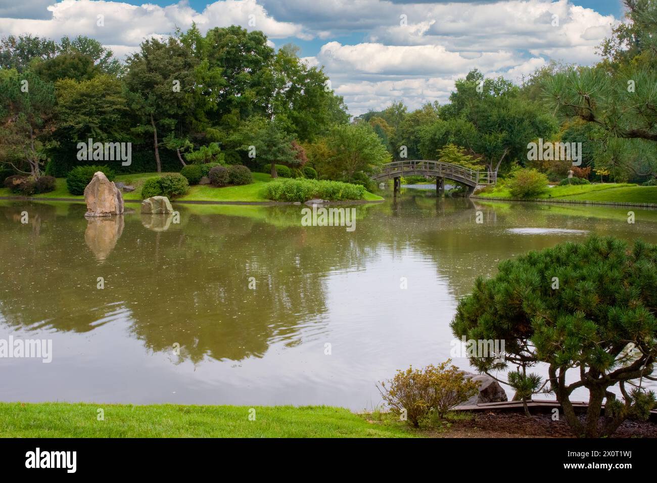 St. Louis, Missouri.  Missouri Botanical Garden, Japanese Garden, Drum Bridge.  Paradise Island, the three massive stones on the left, represent Mount Stock Photo