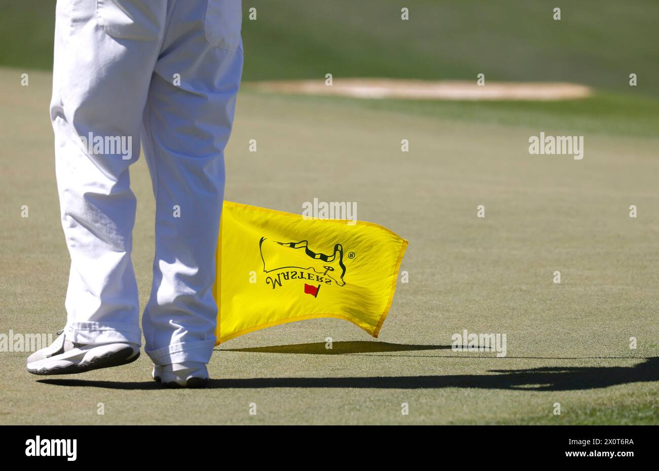 Augusta, United States. 13th Apr, 2024. Sweden's Ludvig Aberg's caddie holds the flag upside down on the seventh hole during the third round of the Masters Tournament at Augusta National Golf Club in Augusta, Georgia on Saturday, April 13, 2024. Photo by Tannen Murray/UPI Credit: UPI/Alamy Live News Stock Photo