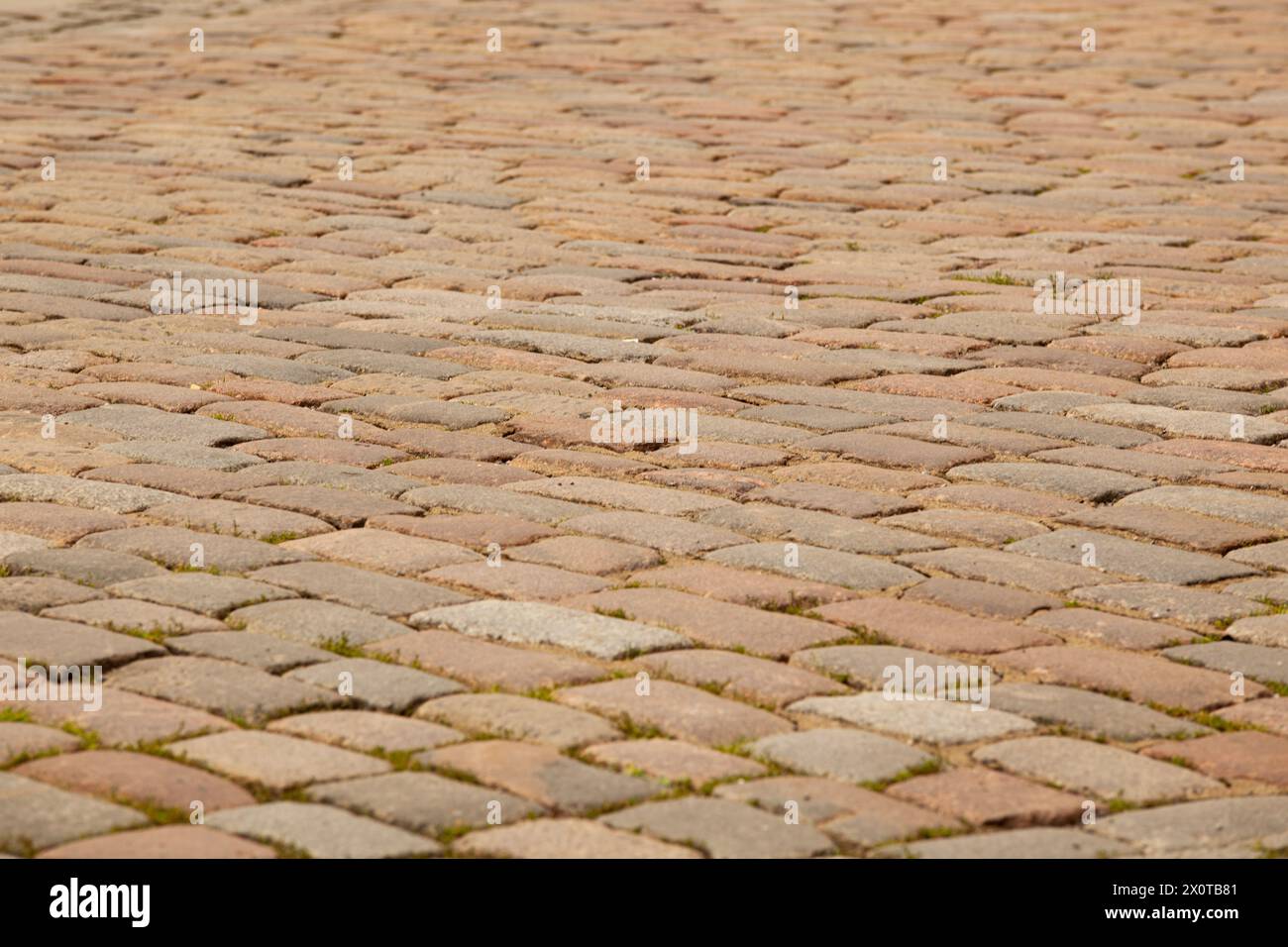 Street pavement texture in tiles. Grey rectangular old tiles. For text. Background. Horizontal. Stock Photo