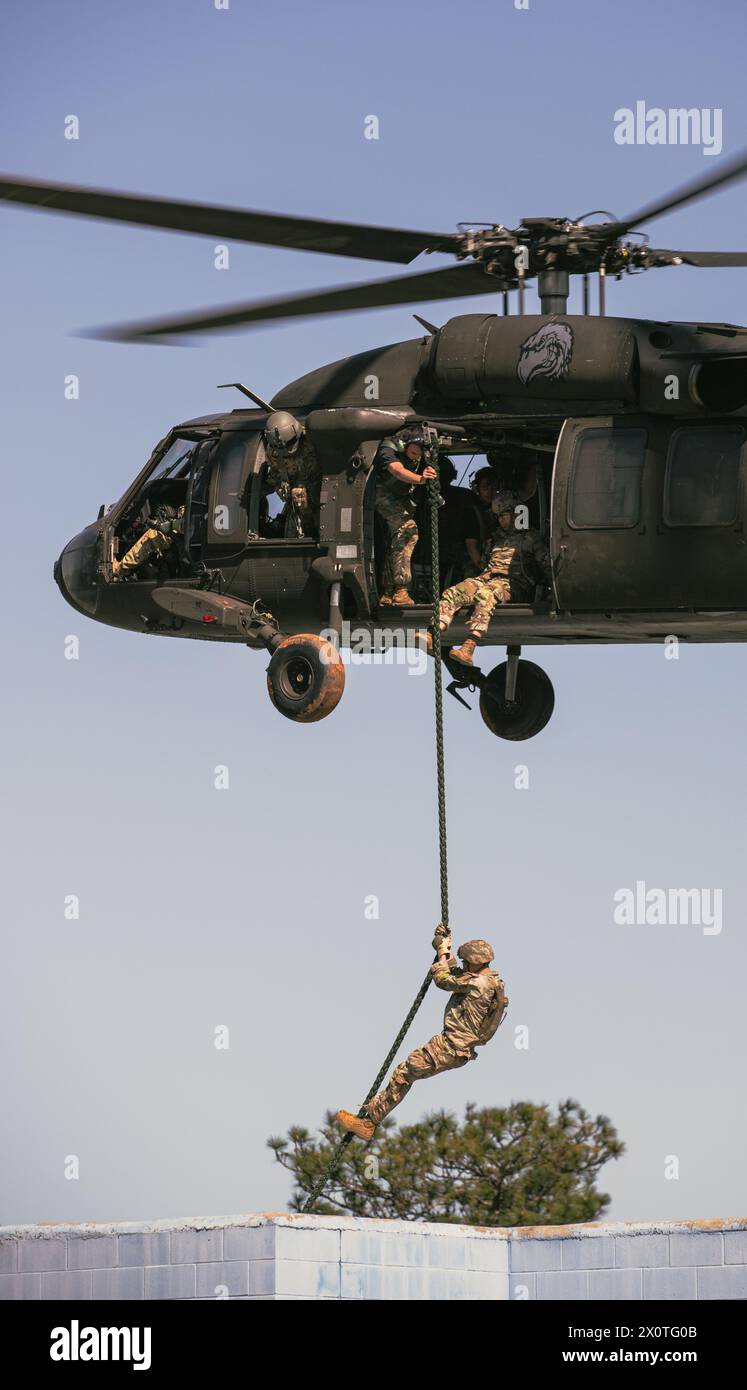 Soldiers repel off a helicopter during the 2024 Best Ranger Competition ...