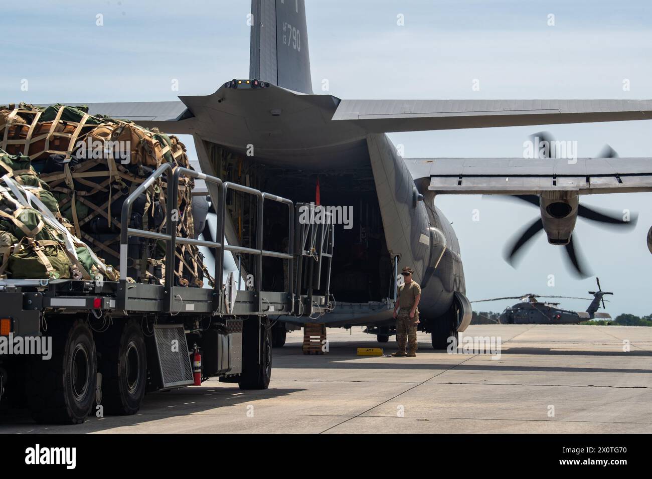 A U.S. Air Force Airman assigned to the 23rd Wing prepares to load luggage onto an HC-130J Combat King II in support of Exercise Ready Tiger at Moody Air Force Base, Georgia, April 8, 2024. The luggage was vital to the mission as it held the departing Airmen’s personal bags and equipment. Built upon Air Combat Command's directive to assert air power in contested environments, Exercise Ready Tiger 24-1 aims to test and enhance the 23rd Wing’s proficiency in executing Lead Wing and Expeditionary Air Base concepts through Agile Combat Employment and command and control operations. (U.S. Air Force Stock Photo