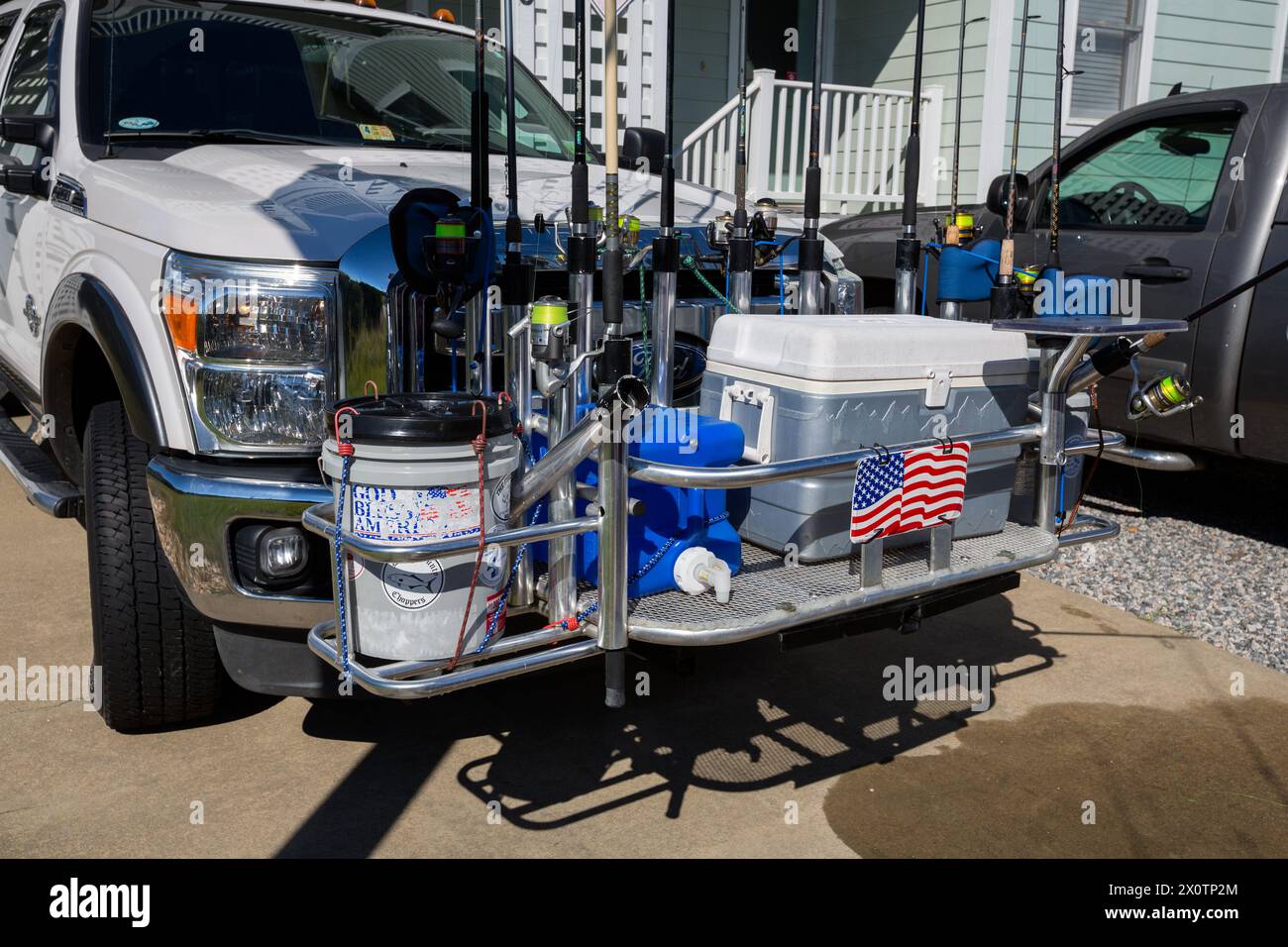 Outer Banks, Avon, North Carolina.  Fisherman's Rig on Front of Pick-up Truck.  Bait Bucket, Ice Chest, Fishing Rods. Stock Photo