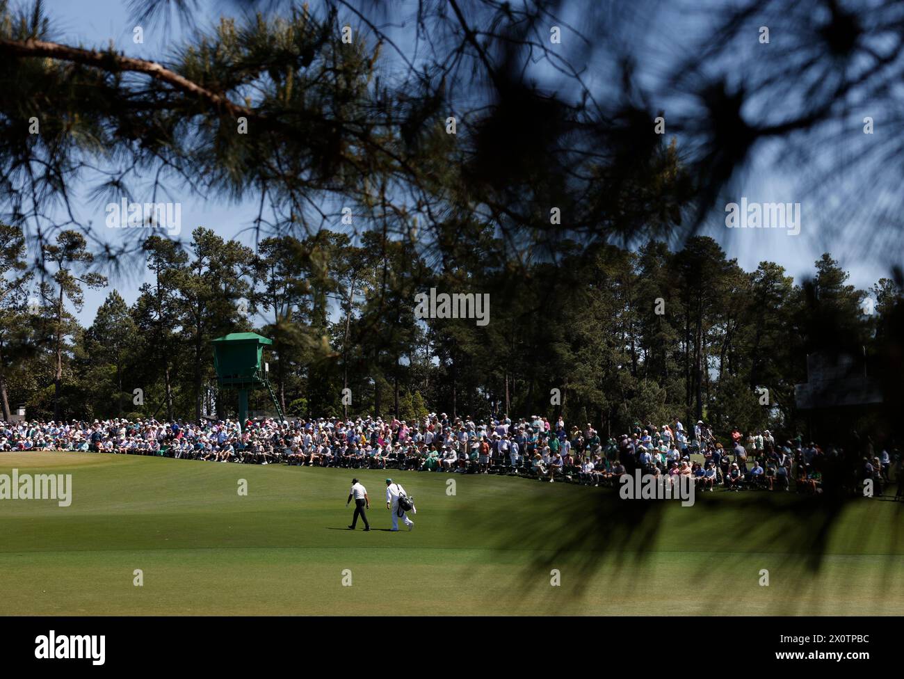 Augusta, United States. 13th Apr, 2024. Tiger Woods and his caddie Lance Bennett walk up the ninth fairway during the third round of the Masters Tournament at Augusta National Golf Club in Augusta, Georgia on Saturday, April 13, 2024. Photo by John Angelillo/UPI Credit: UPI/Alamy Live News Stock Photo